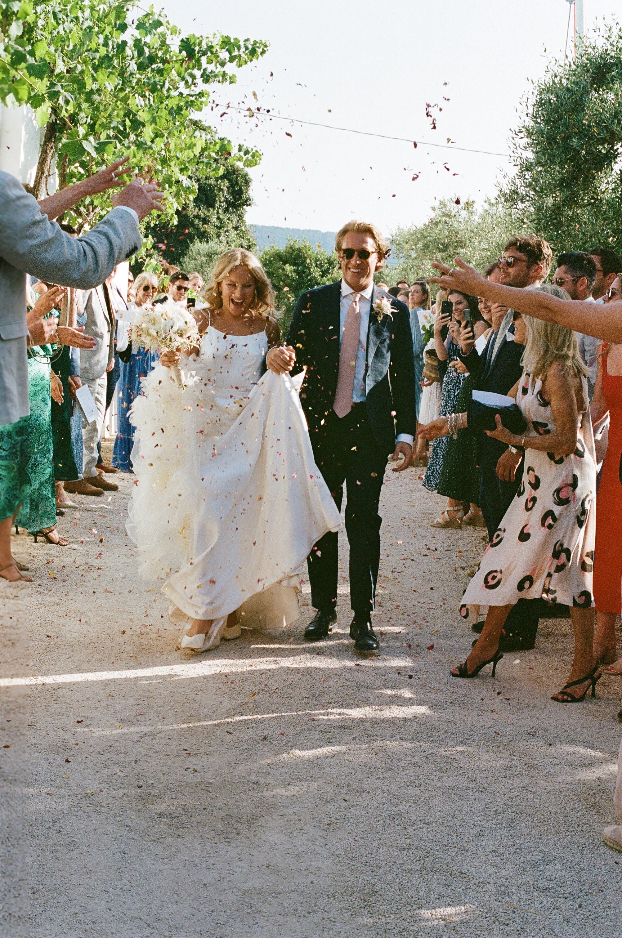 Beautiful bride Rosie wore the Thea wedding dress, Soft Dandelion veil and Ariel bow by Halfpenny London for a destination wedding in Puglia