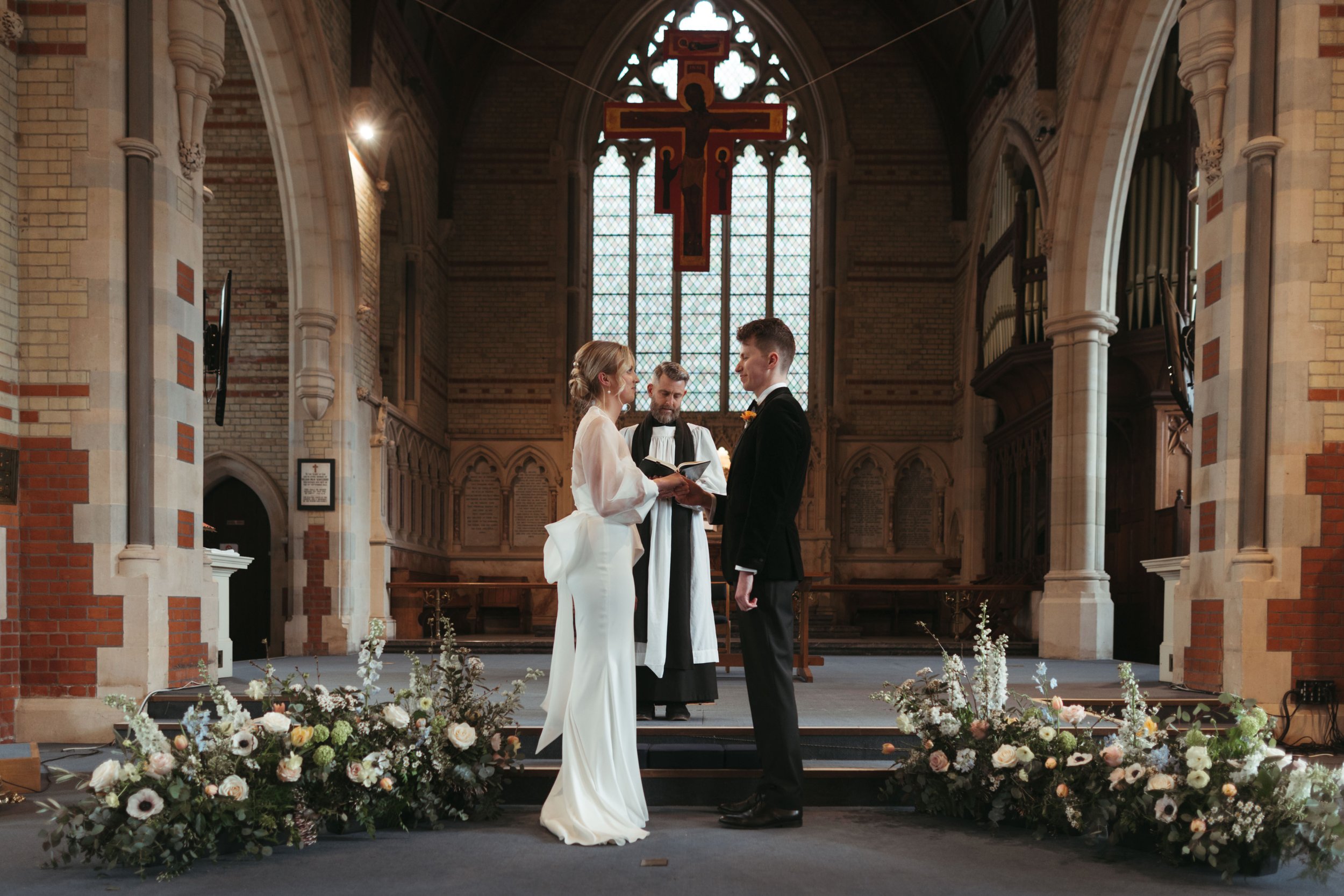 Beautiful bride Anna wears the Oliver dress with the Daniel top and Alpha bow | Wedding dresses by Halfpenny London