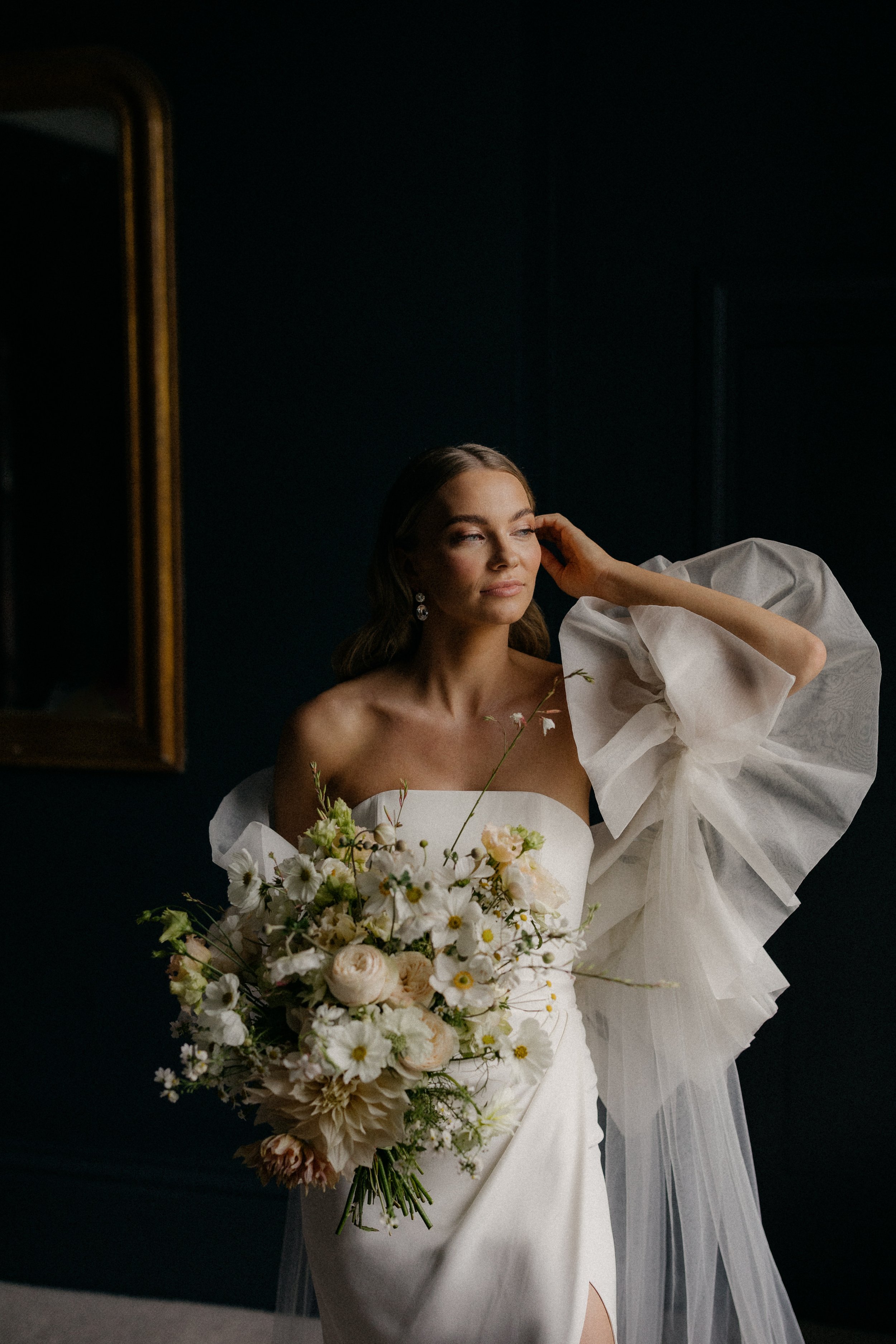 Beautiful bride Mia wears the Oliver corset and Okotan long skirt paired with the Issa shrug and detachable train | Wedding dresses by Halfpenny London