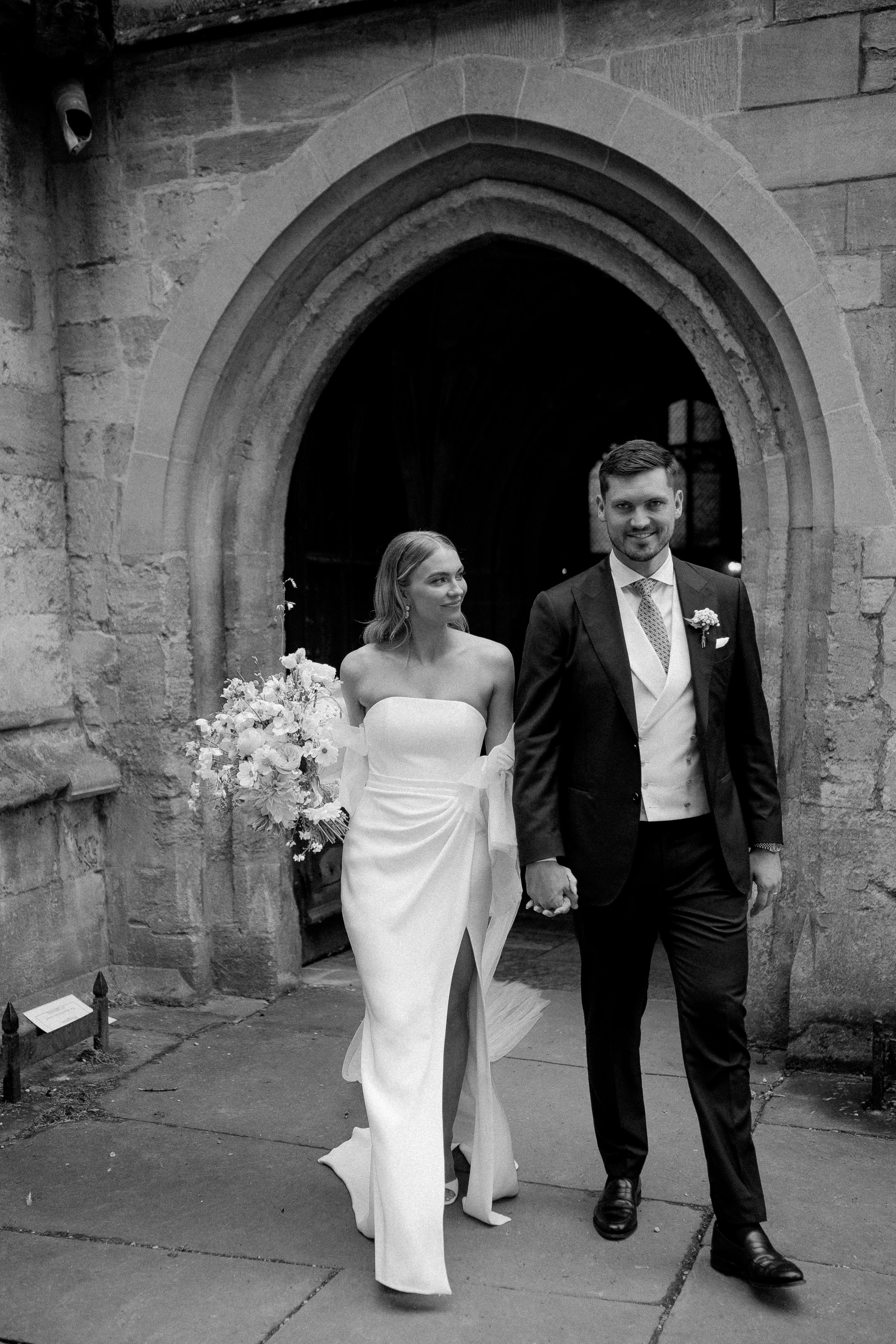 Beautiful bride Mia wears the Oliver corset and Okotan long skirt paired with the Issa shrug and detachable train | Wedding dresses by Halfpenny London