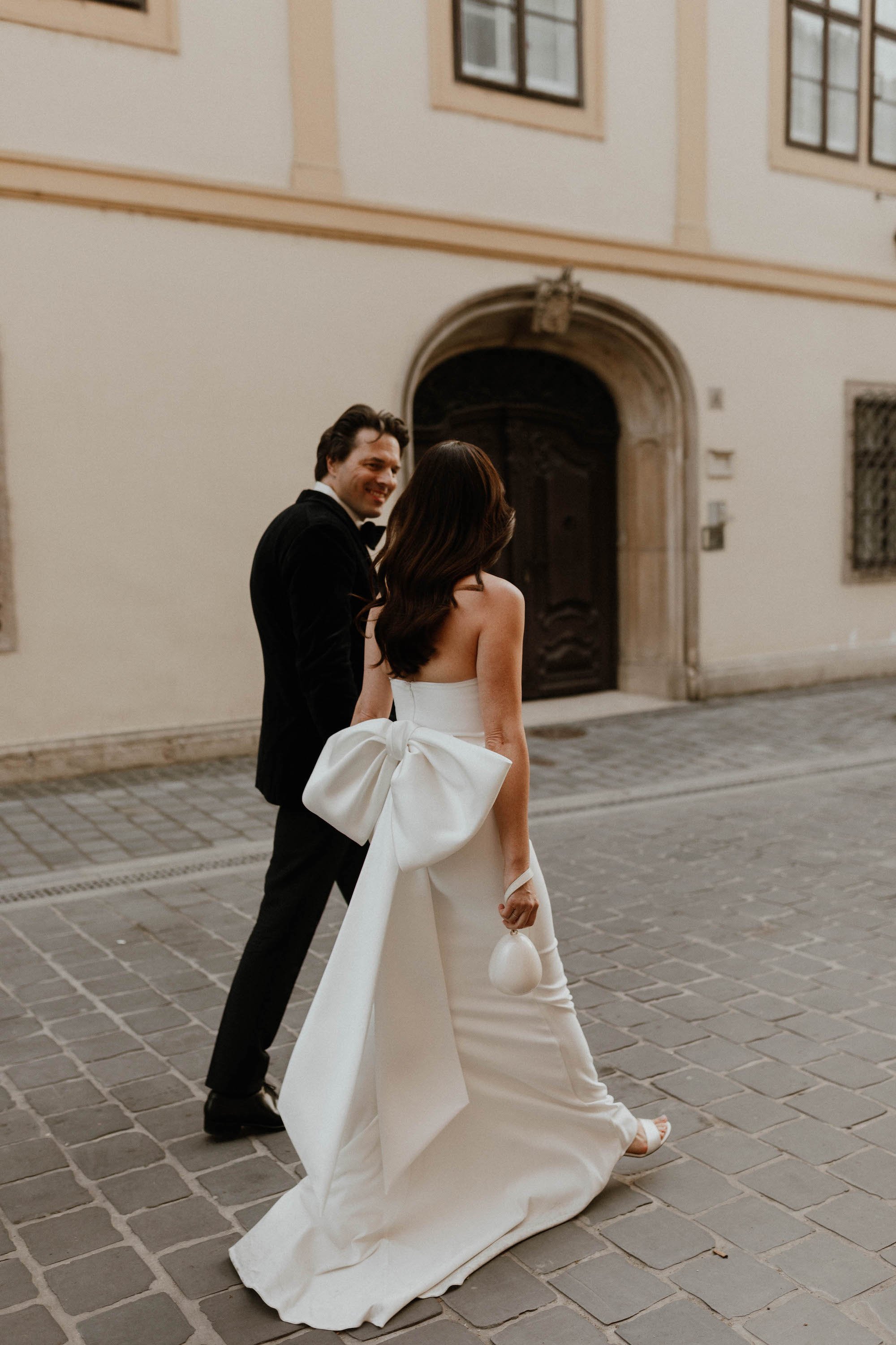 Beautiful bride Zsuzsa wore the Oliver Dress, Manet cape and Ariel bow | Wedding dress by Halfpenny London