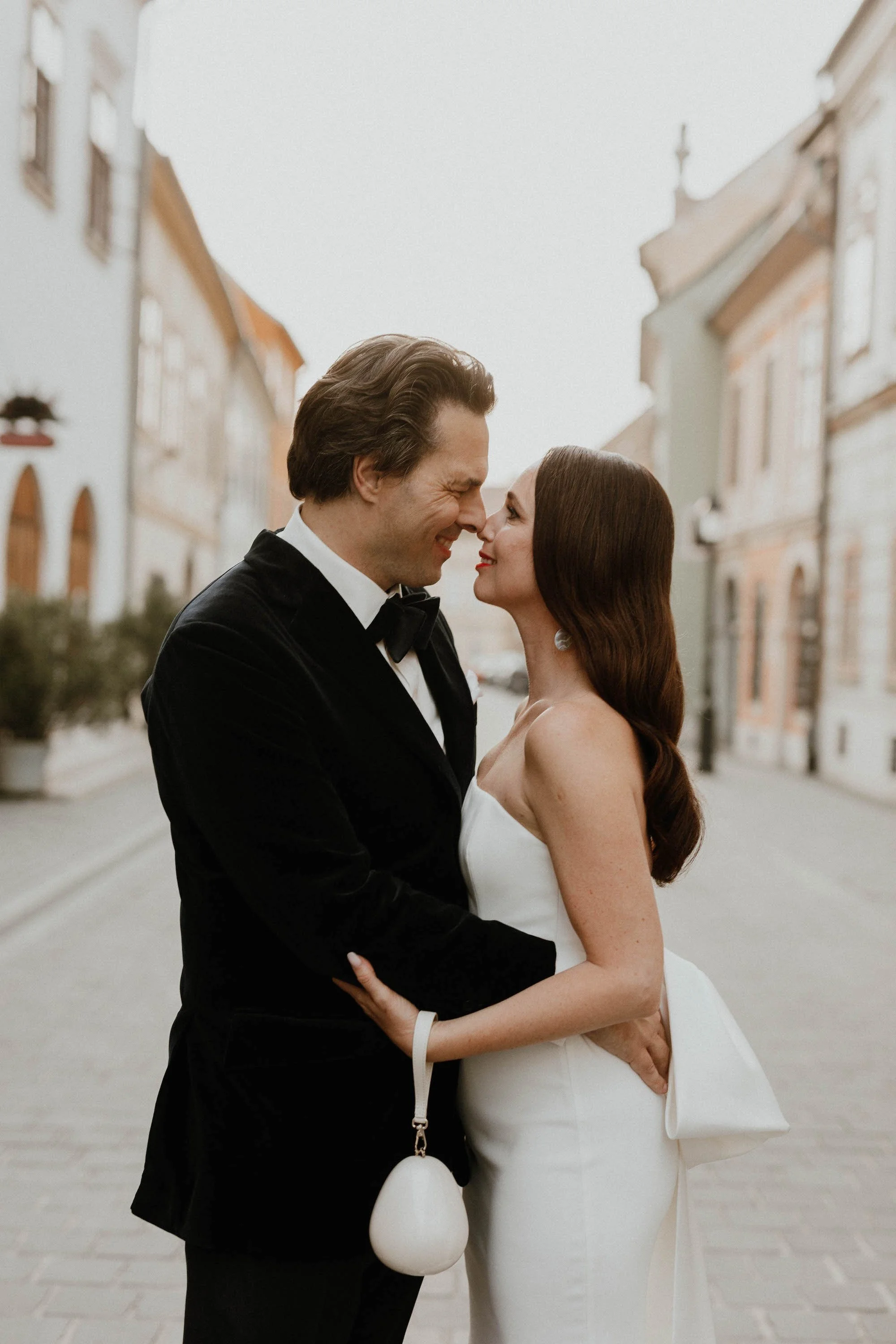 Beautiful bride Zsuzsa wore the Oliver Dress, Manet cape and Ariel bow | Wedding dress by Halfpenny London