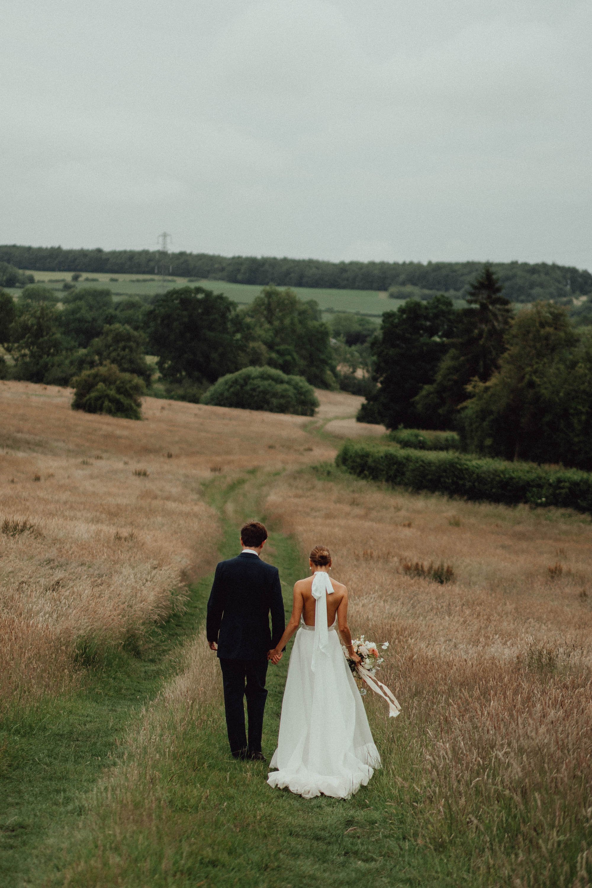 Beautiful bride Laura wears the Cheryl dress and Moon skirt for her wedding day | Wedding dresses by Halfpenny London