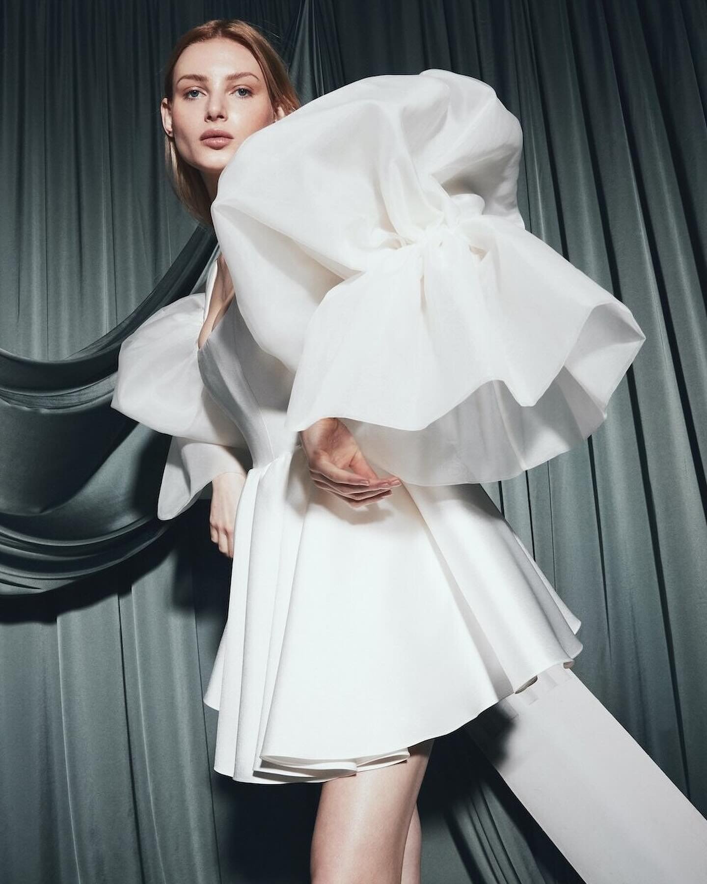 The voluminous silk organza Reflection sleeves are held up with a secure internal structure and gathered at the elbow to bubble at the upper arm for a statement look. 

Shown here with the Molly dress. View the full collection via the link in our bio