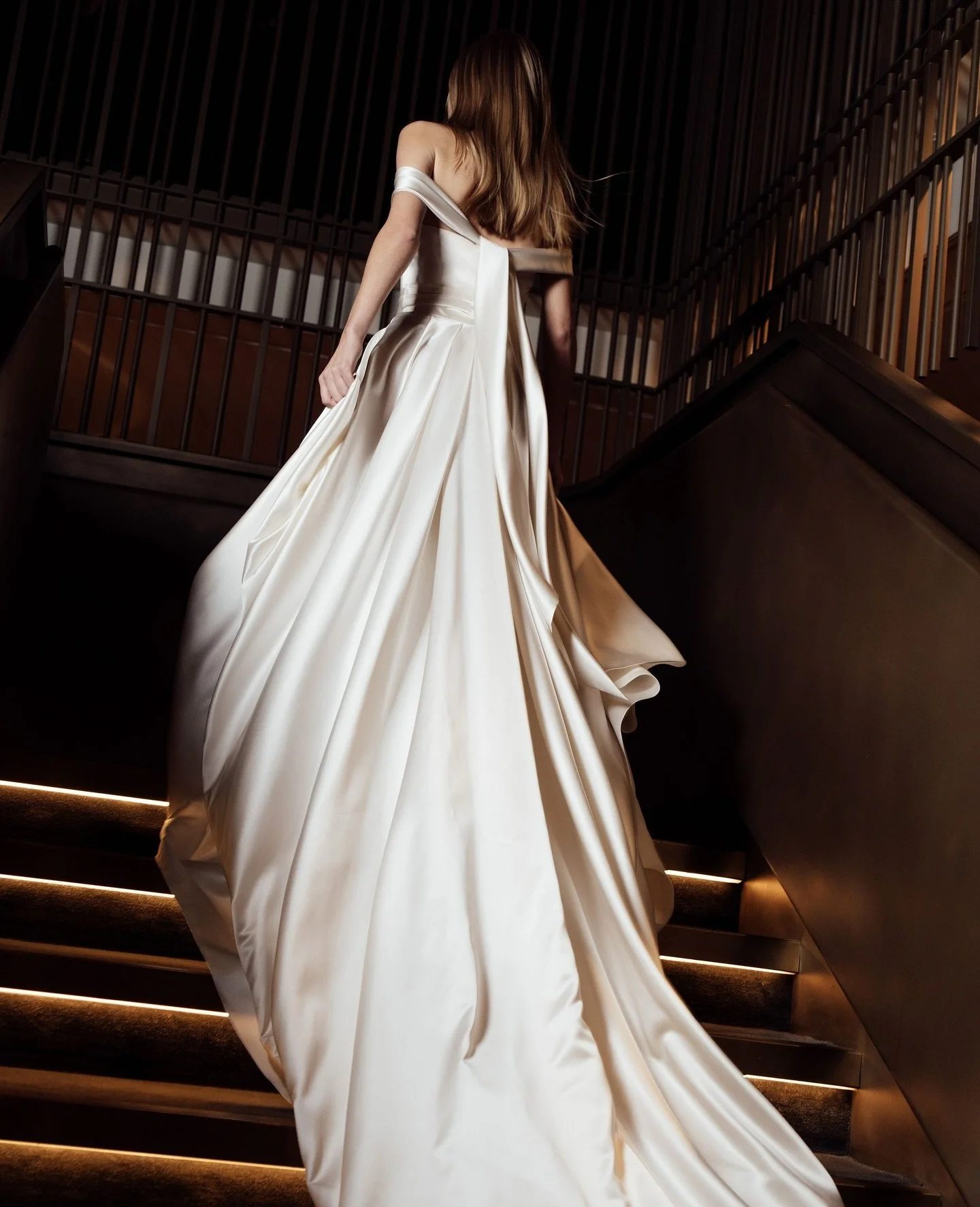 The Dove corset, crafted in duchess satin with an off-shoulder drape, paired with the matching Dove skirt and the Dandelion veil. An effortlessly romantic silhouette that&rsquo;s endlessly versatile.⁠
⁠
Book an appointment at the Halfpenny London fla