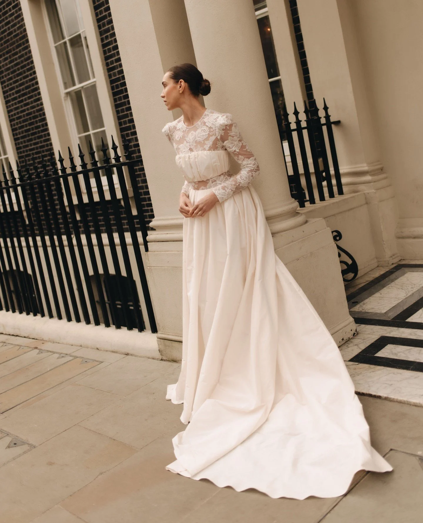 Structured yet romantic, the Amy crop top is crafted in gathered taffeta with a hidden inner fastening and boned foundation, worn here with the sweeping Amy skirt and delicate Ada lace body. The skirt&rsquo;s sculptural box pleats and optional slit c