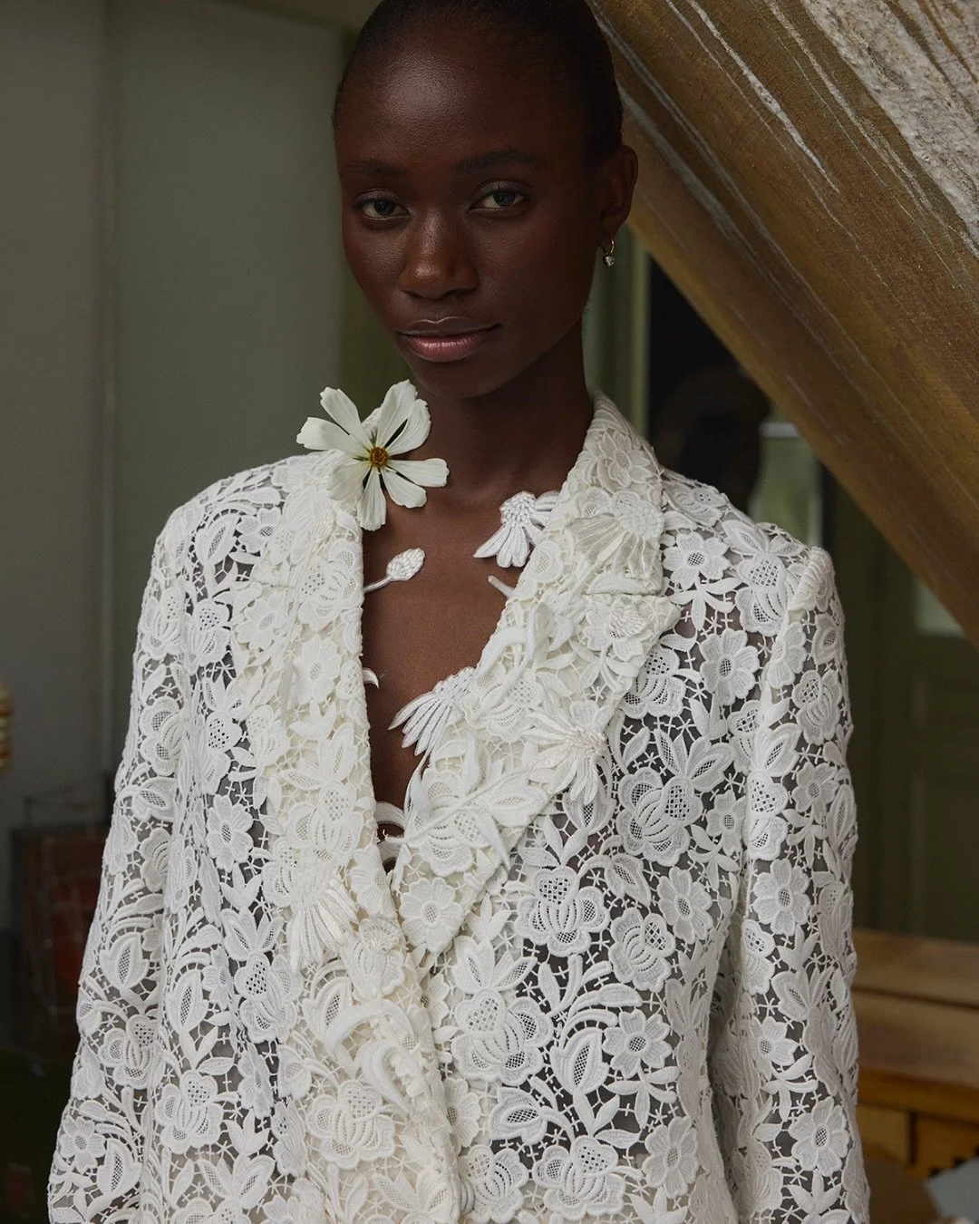 An emotive symbol of resilience, healing, and strength, the echinacea flower appears throughout Twenty Vol. II.⁠
⁠
Hand-embroidered and appliqu&eacute;d onto bold guipure lace, it transforms into both motif and metaphor. ⁠
⁠
Campaign photography: @je