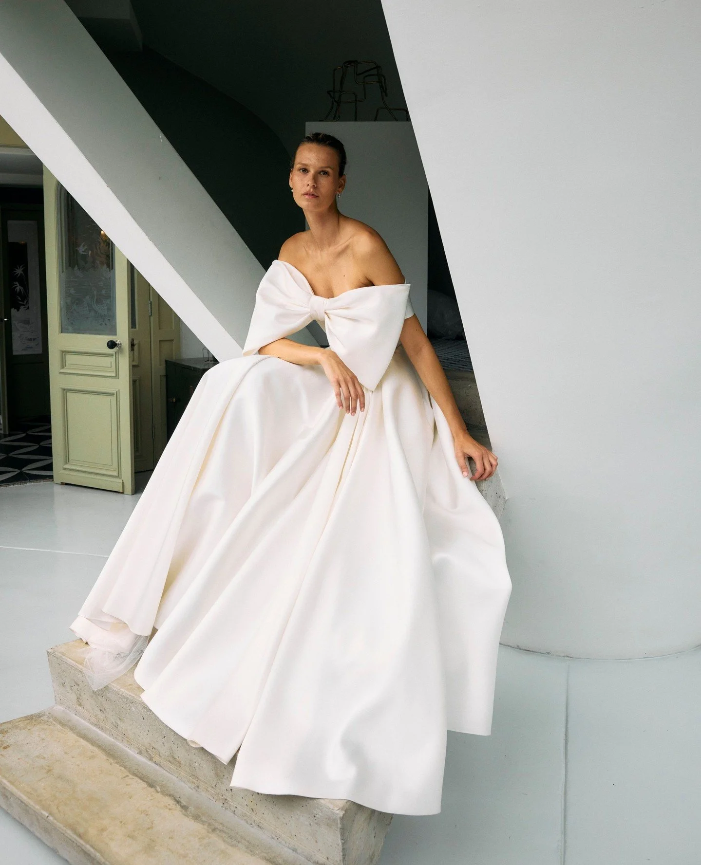 A Twenty Vol. II Collection favourite: The Junie dress.

Styled with the Junie bow shrug, on its own or layered with the Emmeline shrug and Alvina veil, each combination creates a distinct moment of modern elegance. Perfect for personalising your loo