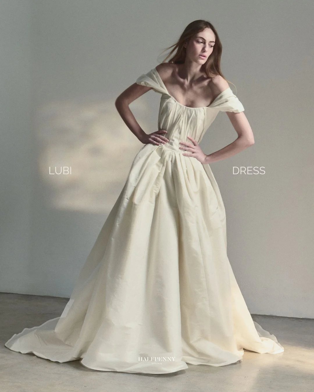 The Lubi dress.⁠
⁠
A corseted foundation supports the body, while weightless taffeta falls into soft pleats. Detachable sleeves and a convertible silhouette allow it to shift effortlessly throughout the day.⁠A dress that moves with you through your w