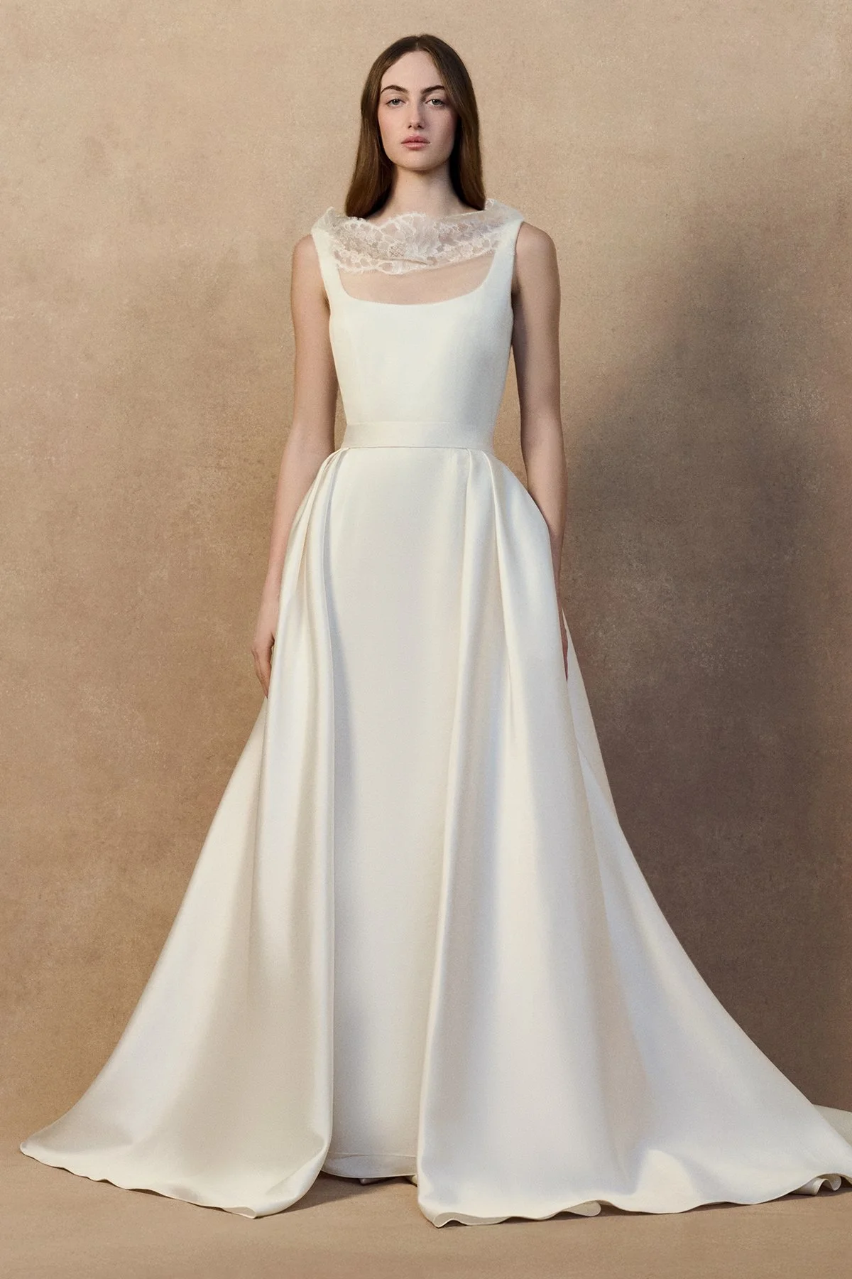 front image of monty dress with a sheer organza overlay and high neckline, an open back and a crepe-back satin underdress with a soft fit-and-flare silhouette. worn with Dahlia overskirt