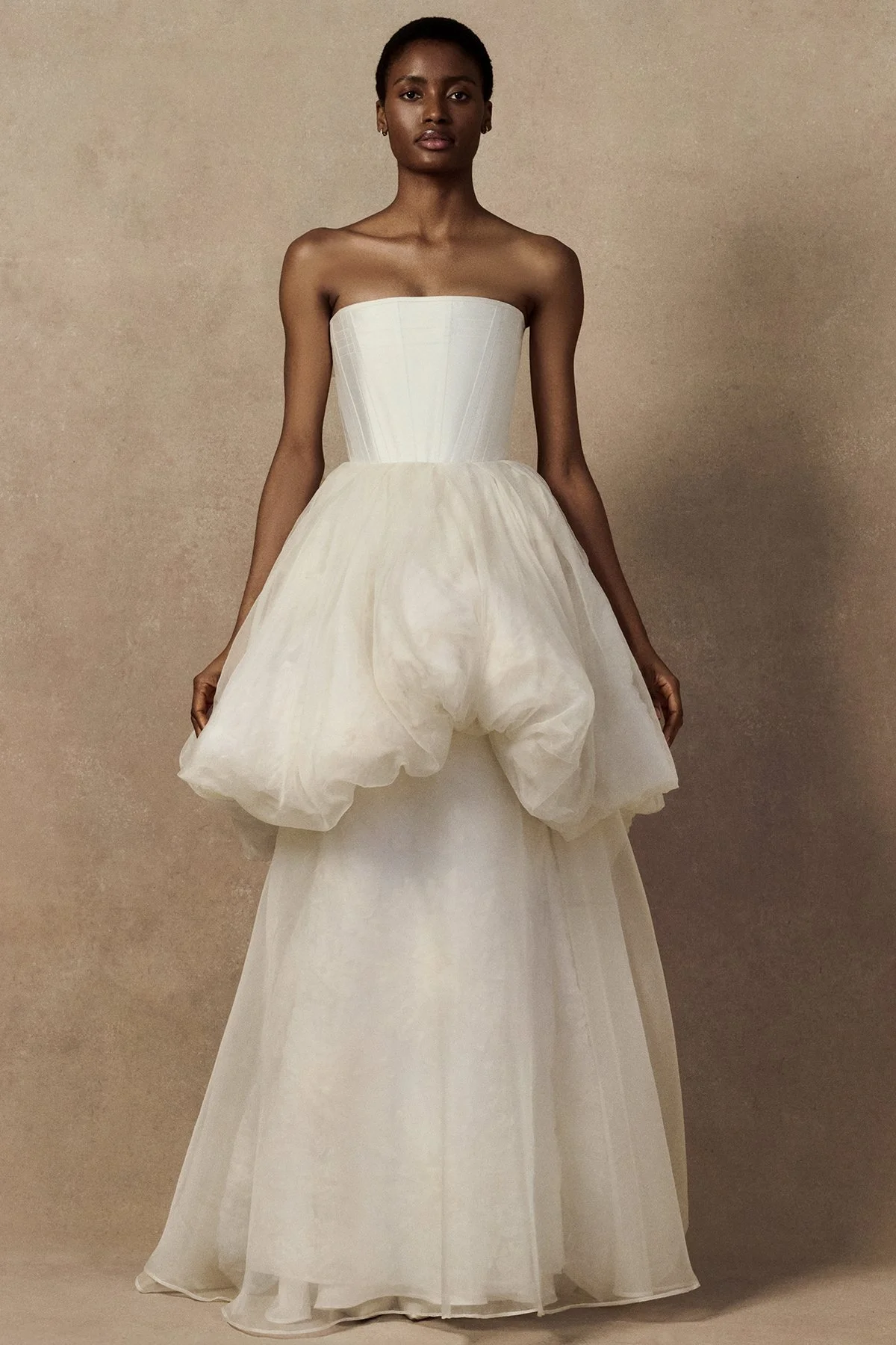 front image of Meg bridal skirt with looped daisies in raw-edged silk organza, and a layered silk organza fit-and-flare skirt. with phoenix corset and meg mini skirt