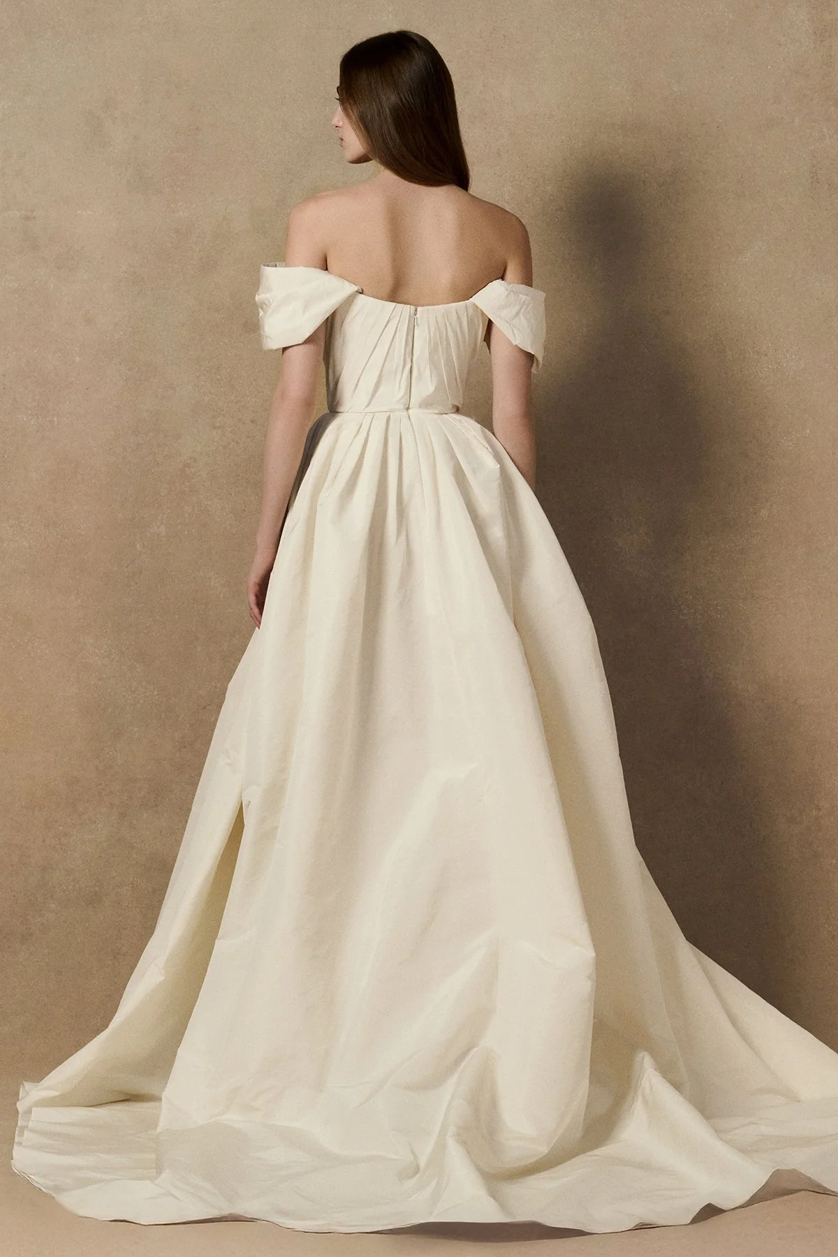 back image of Lubi dress in pleated weightless taffeta, featuring a structured support corset, shown with sleeves and full length gown