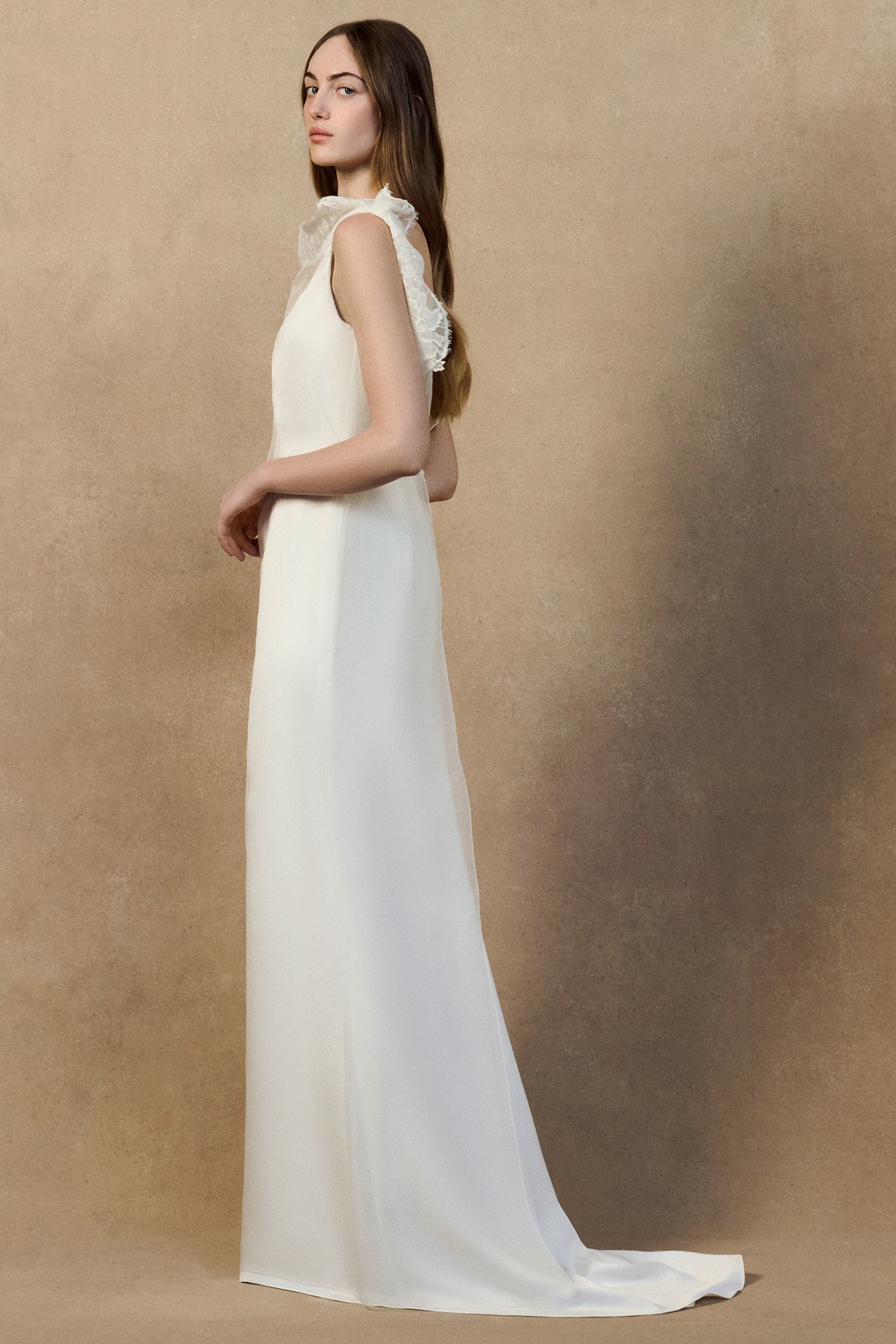 side image of monty dress with a sheer organza overlay and high neckline, an open back and a crepe-back satin underdress with a soft fit-and-flare silhouette.