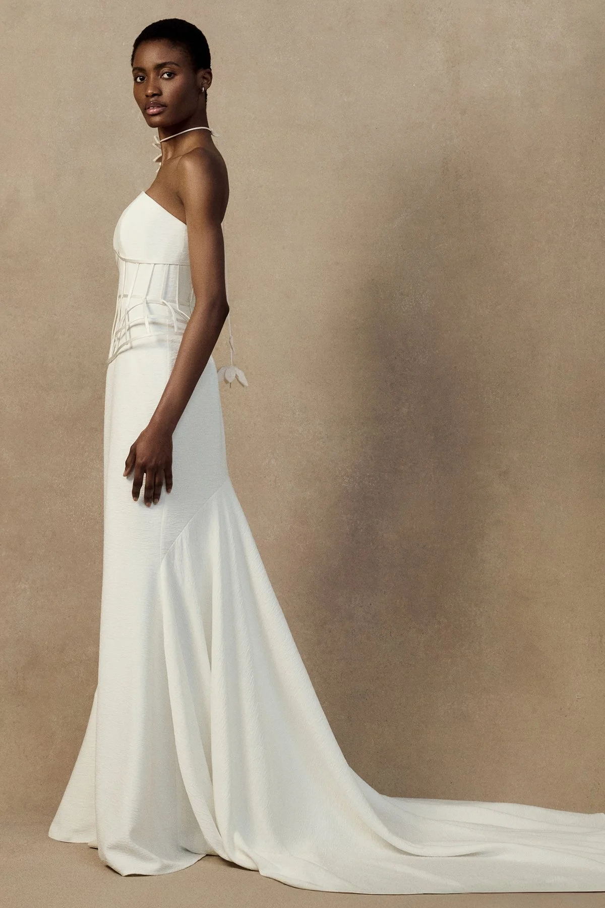 side image of the Han waspie high-waisted corseted belt in Duchess Satin with bound boning and an exaggerated hip silhouette