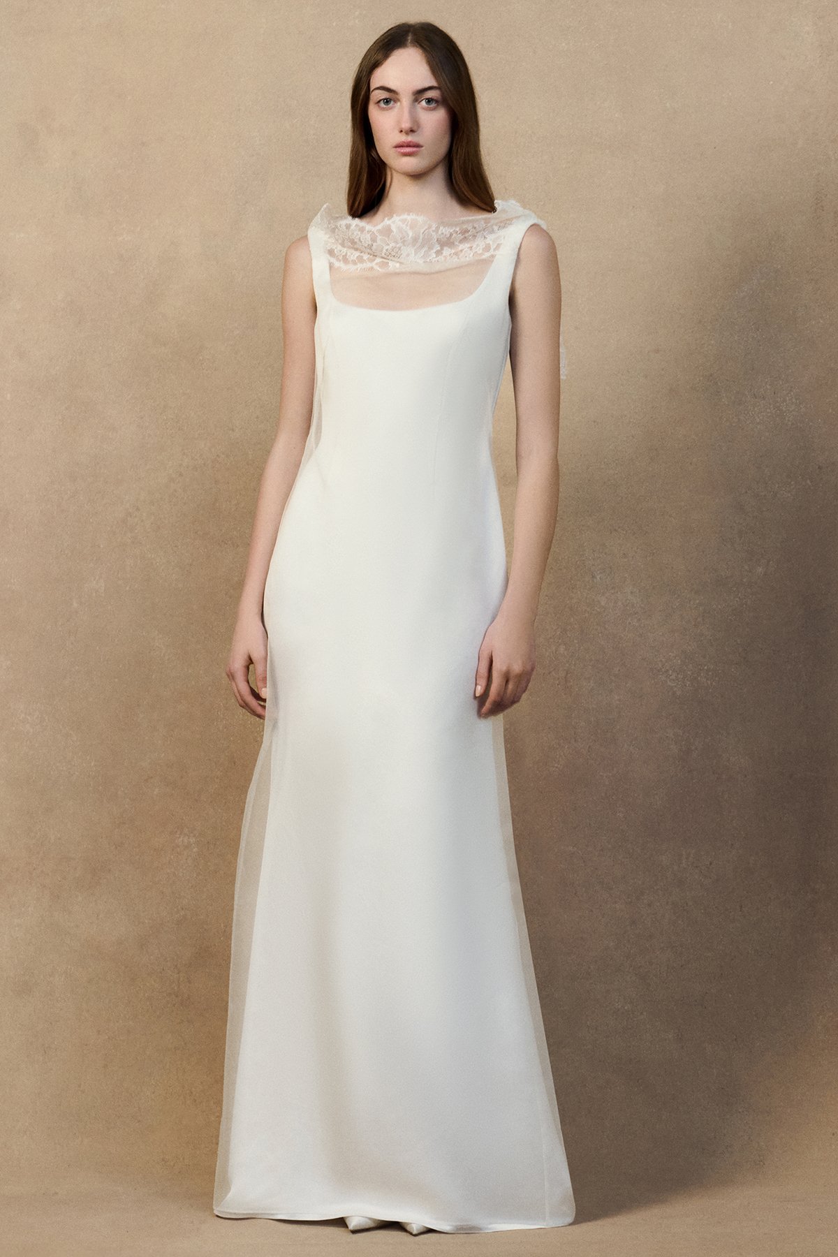 front image of monty dress with a sheer organza overlay and high neckline, an open back and a crepe-back satin underdress with a soft fit-and-flare silhouette.