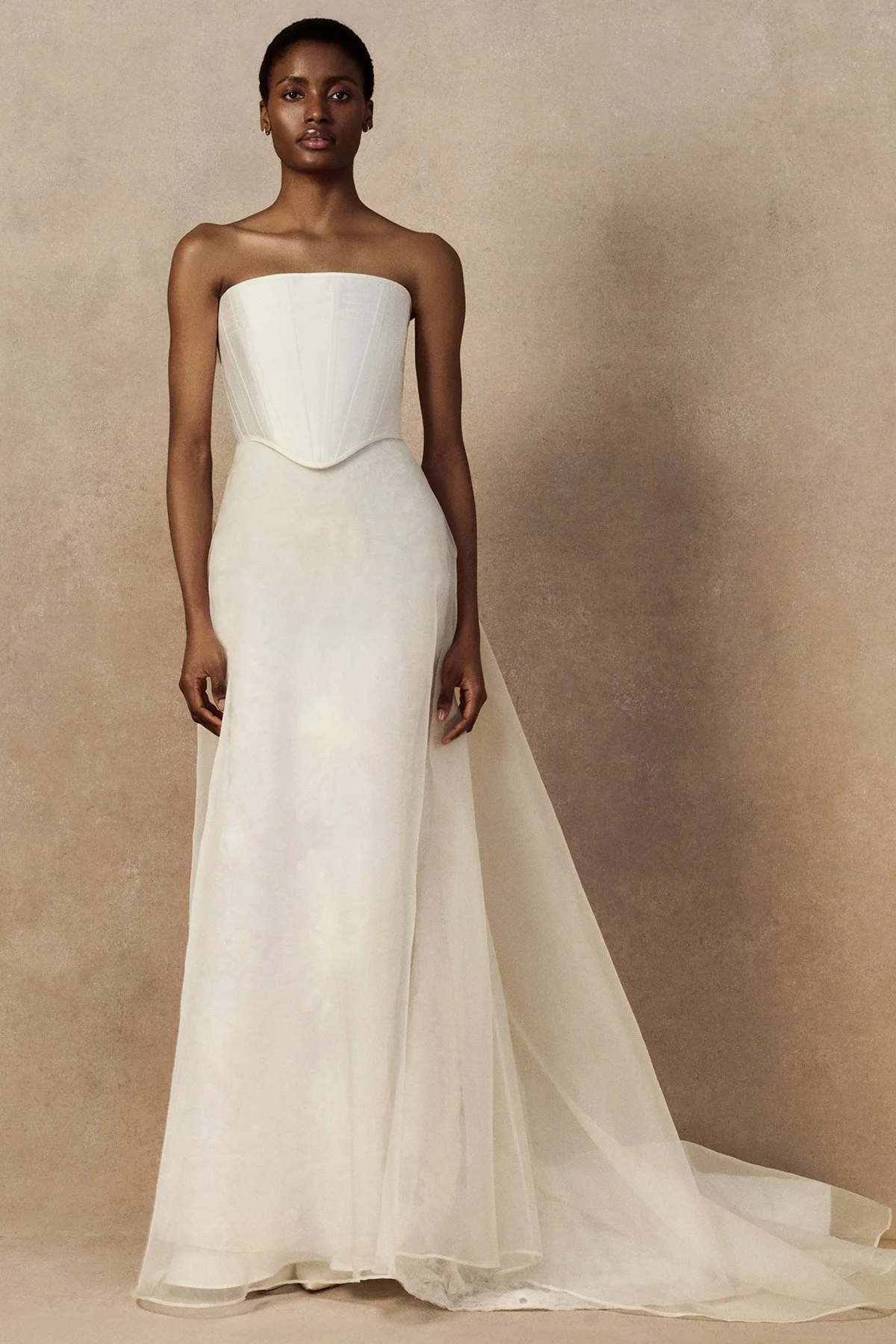 front image of Meg bridal skirt with looped daisies in raw-edged silk organza, and a layered silk organza fit-and-flare skirt.