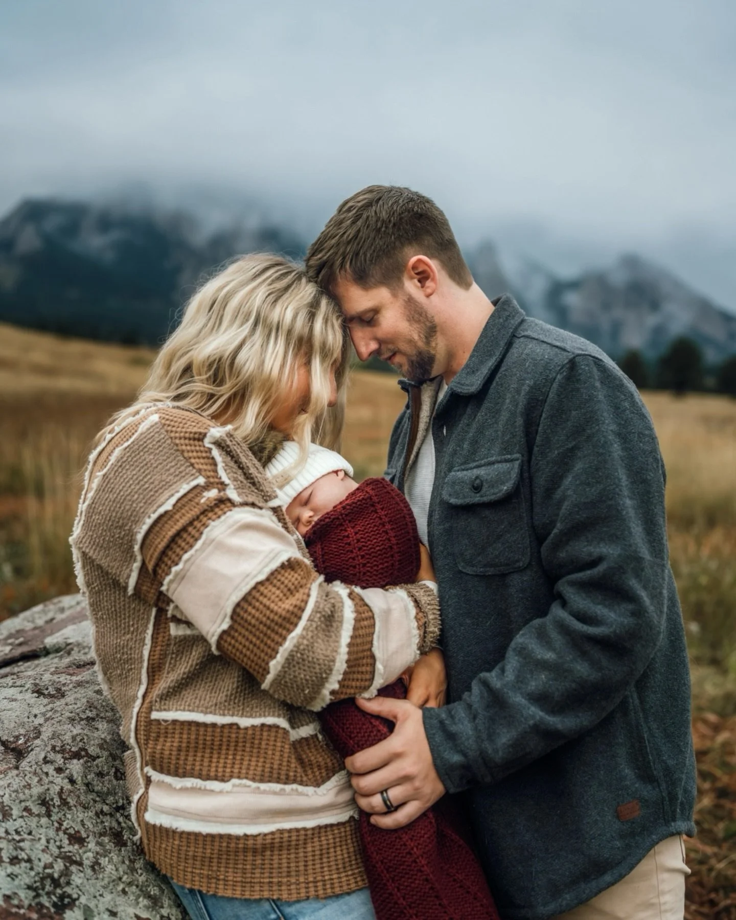 Fog swirling around the mountains, baby snuggled up, parents holding on. Simple, real and full of feeling. 

***
family photographer colorado
boulder newborn photographer 
outdoor newborn session 
mountain family photos