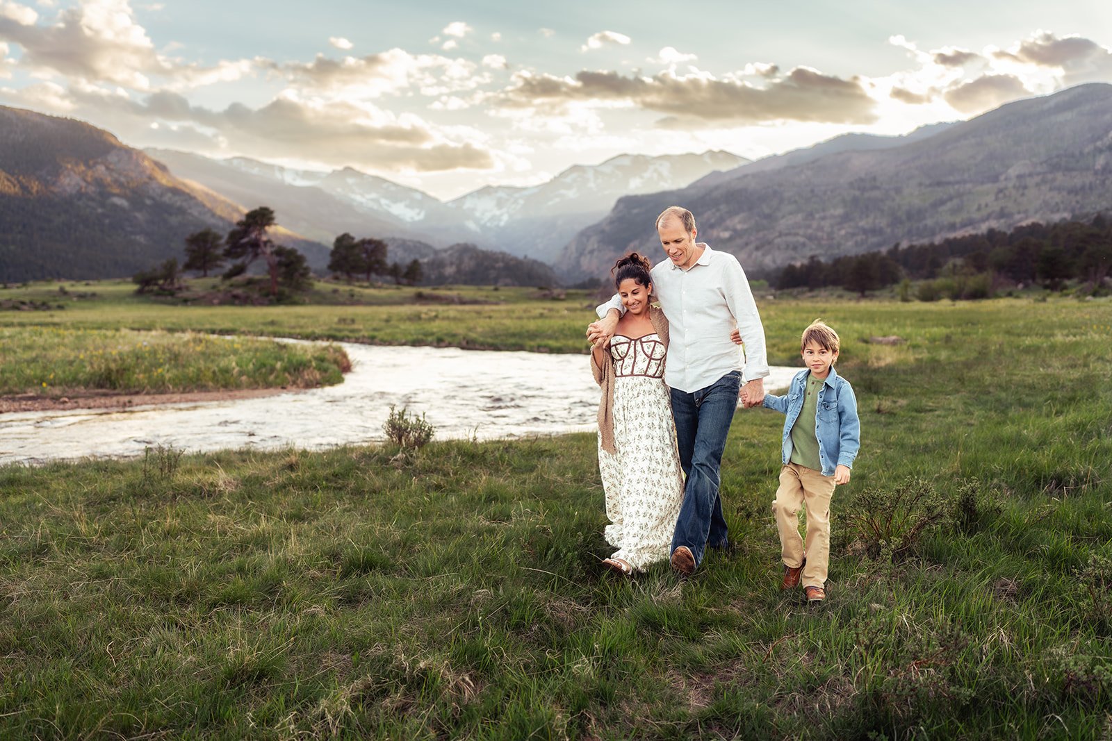 Denver family photographer | Family walking through grasses, arms around each other