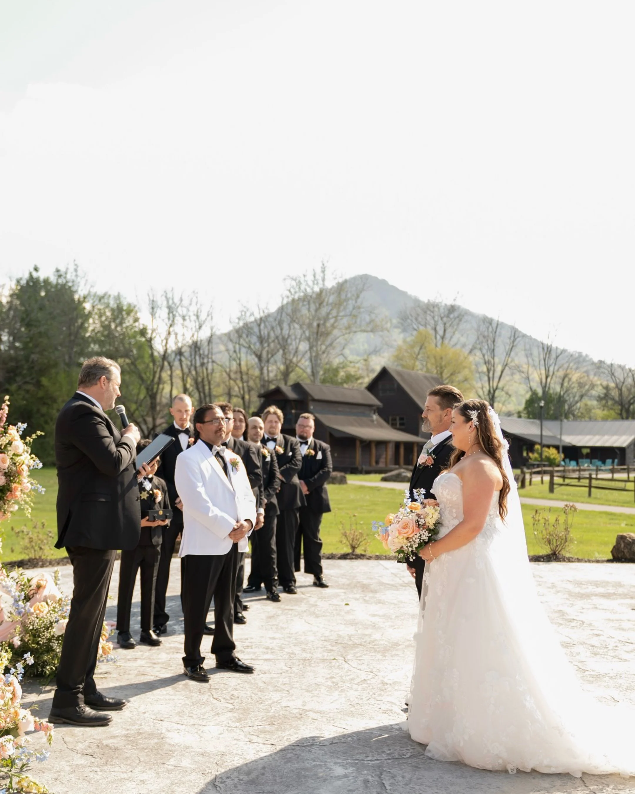 &hellip;Despite the unusually hot April day, romance filled every corner. The bride&rsquo;s dress moved softly in the warm breeze, flowers bloomed in vibrant color, and the sunset wrapped everyone in glowing amber light. Guests kicked off their shoes