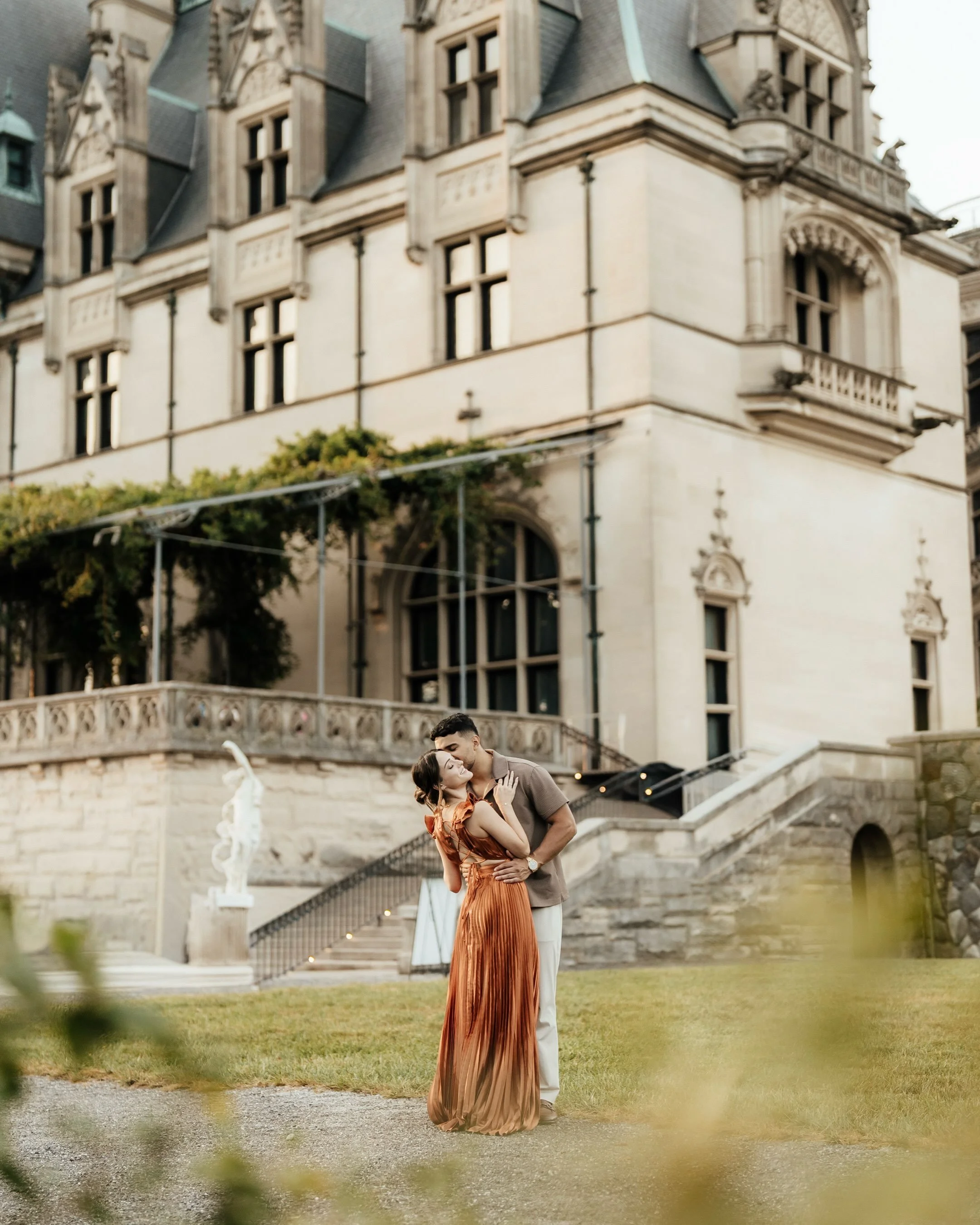 A love story framed by timeless architecture, soft evening light, and the kind of connection that makes everything else fade away. 🤍

Capturing this beautiful couple during their engagement session at Biltmore Estate in Asheville was nothing short o