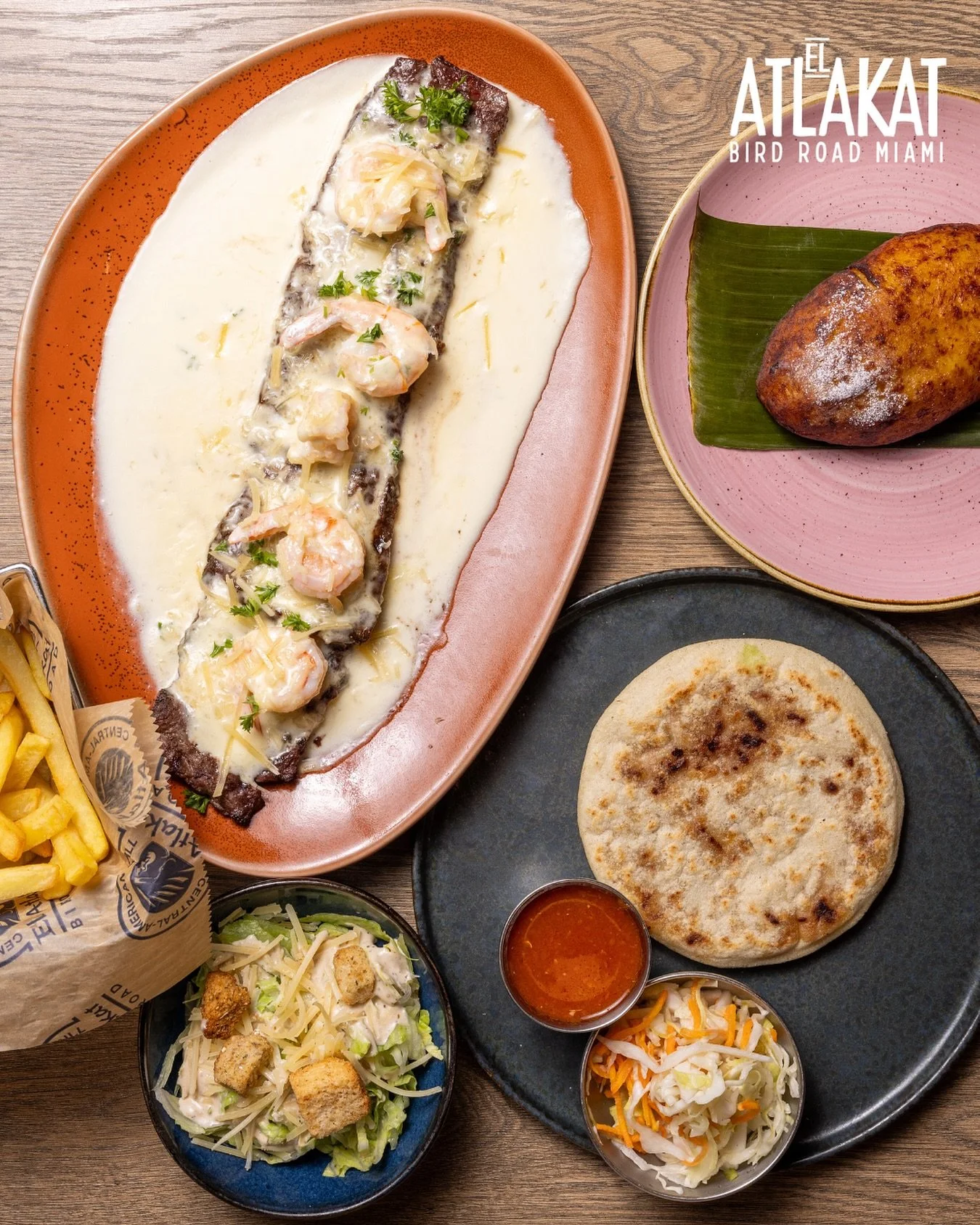 A taste of El Salvador on one plate 🇸🇻💫 Grilled churrasco bathed in creamy cheese sauce, shrimp on top, and the perfect pair: a pupusa and a sweet plantain empanada.
ONLY AT BIRD ROAD: 9425 S.W. 40th. Street. Miami, FL 33165 
💻 Orders, deli