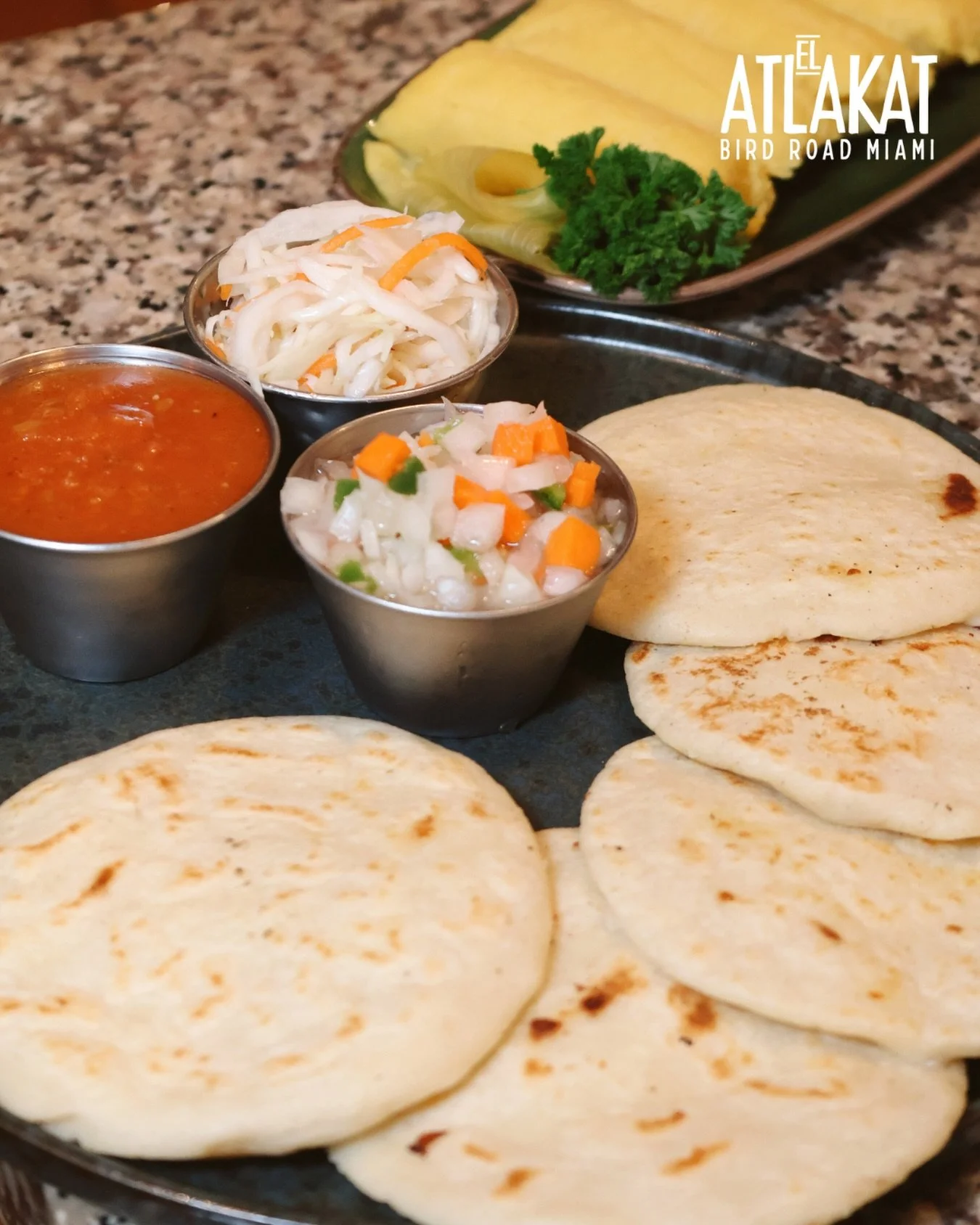 A little piece of home in every pupusa 🇸🇻💛. Made by hand, made with love, made with pride.

ONLY AT BIRD ROAD: 9425 S.W. 40th. Street. Miami, FL 33165&nbsp;
💻 Orders, delivery and reservations at www.elatlakat.com
☎️ (305-552-9090) or ☎️ (305-552
