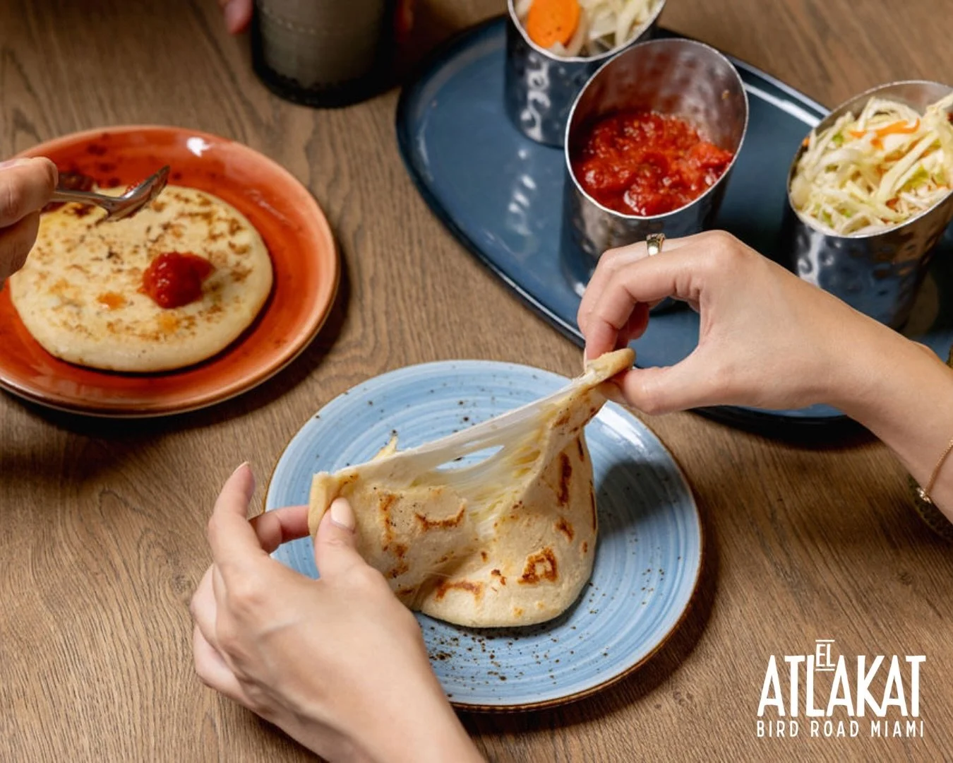 That cheesy pull says it all 🧀🔥 Pure Salvadoran comfort, made to be shared.

ONLY AT BIRD ROAD: 9425 S.W. 40th. Street. Miami, FL 33165&nbsp;
💻 Orders, delivery and reservations at www.elatlakat.com
☎️ (305-552-9090) or ☎️ (305-552-1918)
&nbsp;
#M