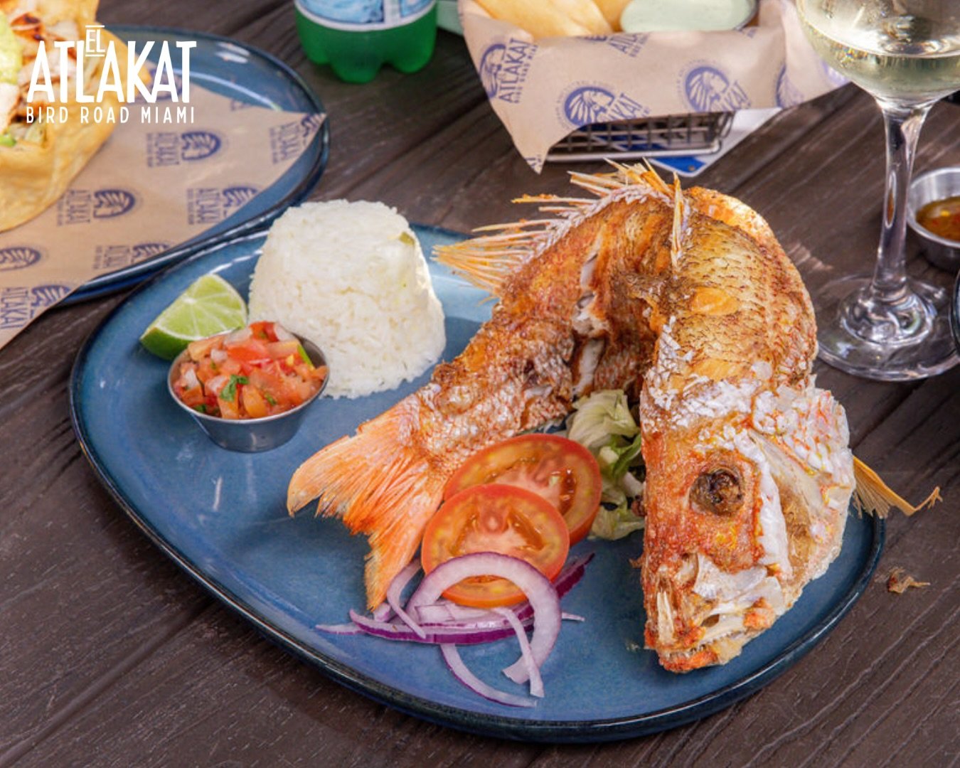 Whole fried red snapper, crispy on the outside, tender on the inside. Fresh, bold and completely irresistible. 🌊✨

ONLY AT BIRD ROAD: 9425 S.W. 40th. Street. Miami, FL 33165&nbsp;
💻 Orders, delivery and reservations at www.elatlakat.com
☎️ (305-552