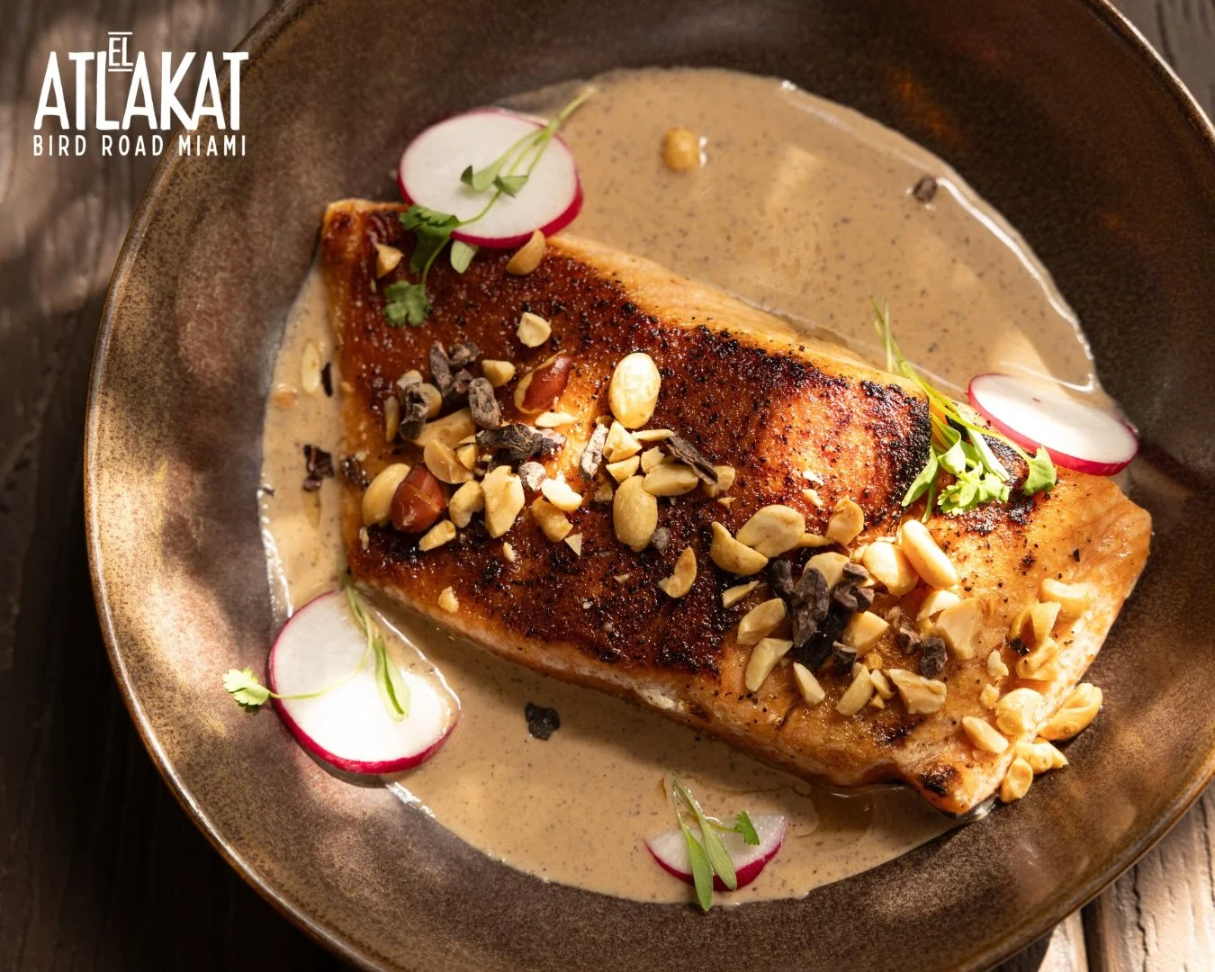 Fresh salmon bathed in a rich morro seed sauce &mdash; a flavor deeply rooted in Salvadoran tradition. Bold, unique and completely unforgettable. 🌿

ONLY AT BIRD ROAD: 9425 S.W. 40th. Street. Miami, FL 33165&nbsp;
💻 Orders, delivery and reservation