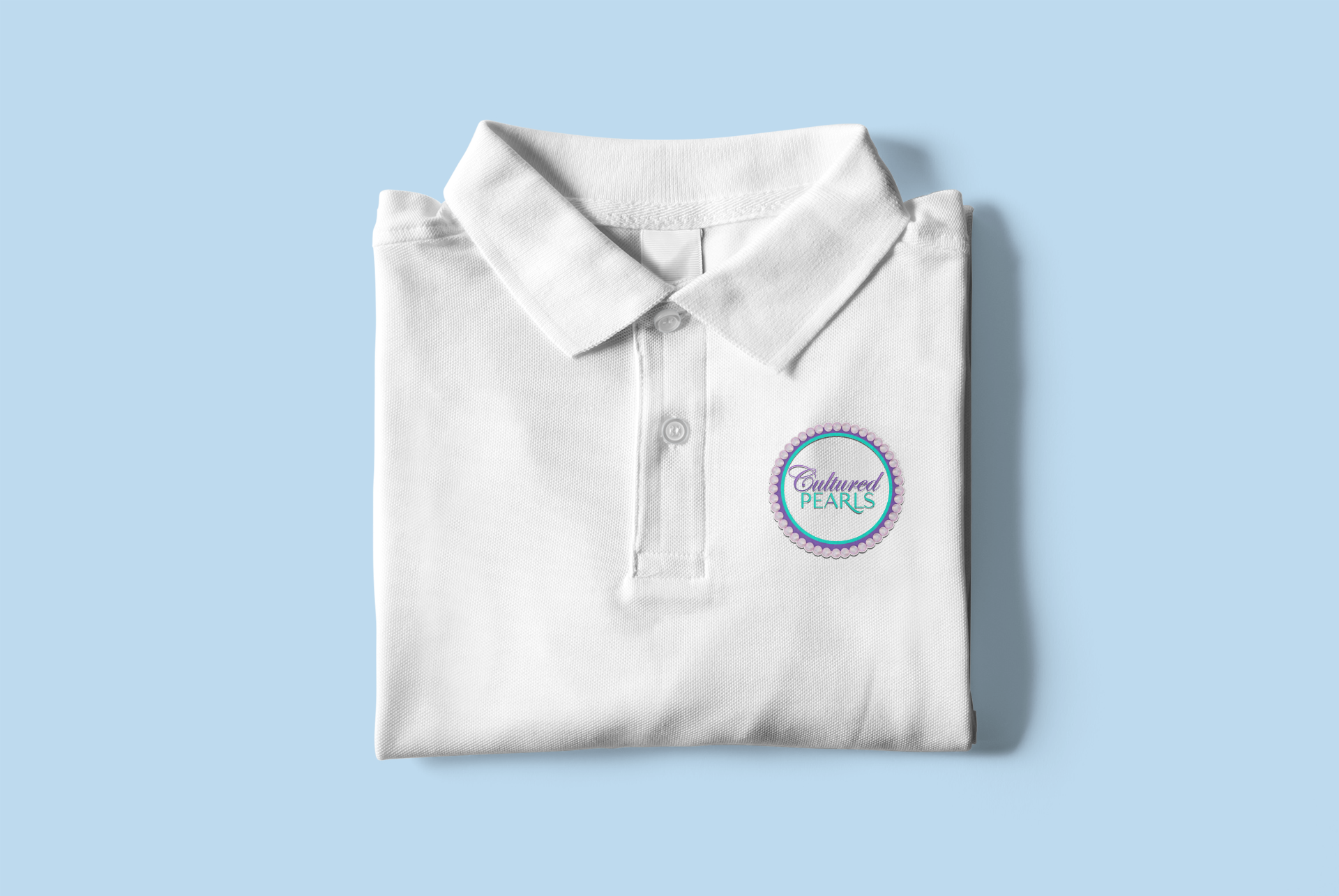 mockup-of-a-folded-polo-shirt-placed-on-a-customizable-surface-3090-el1.png