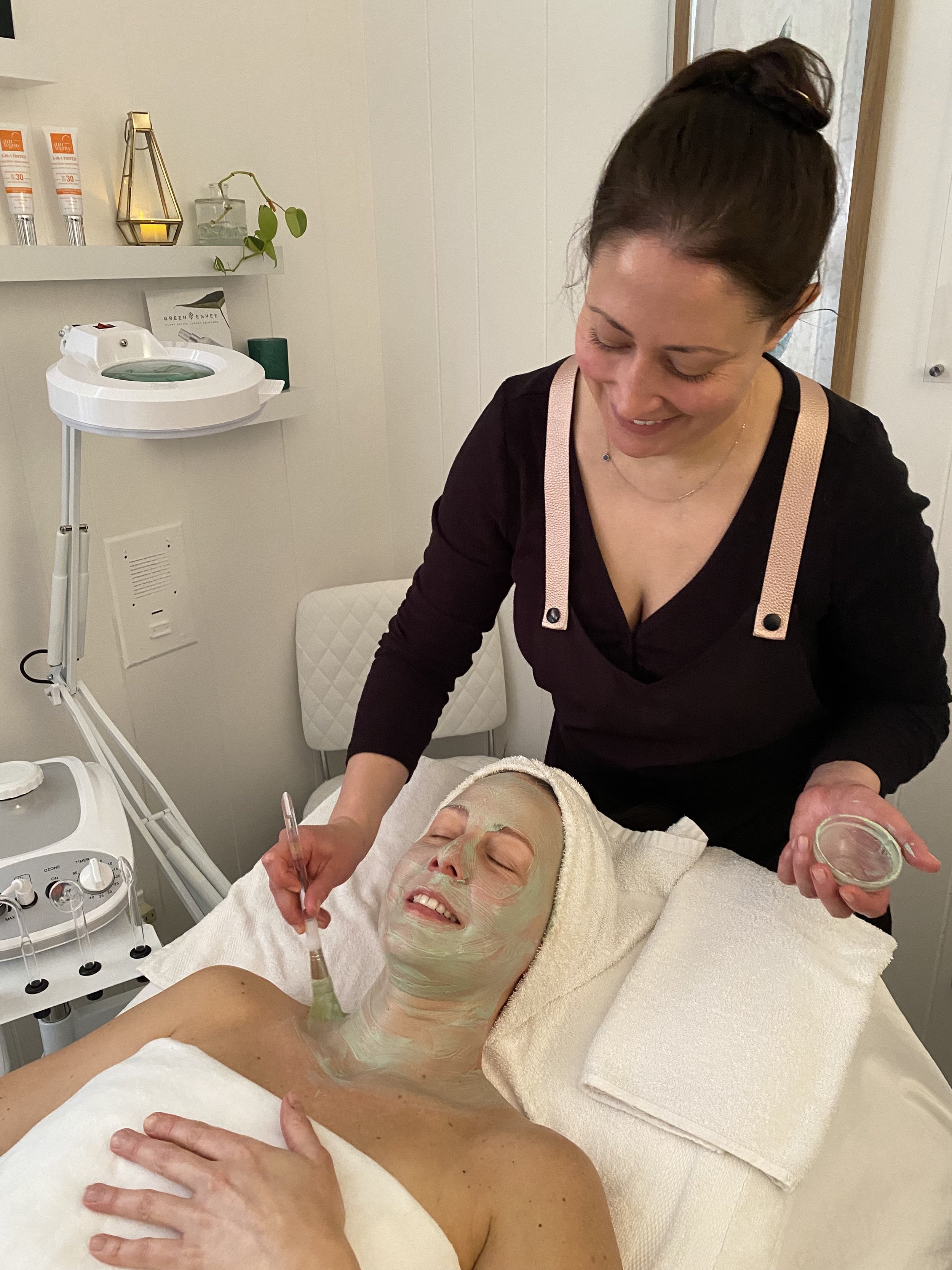Client receiving organic vitamin C facial treatment