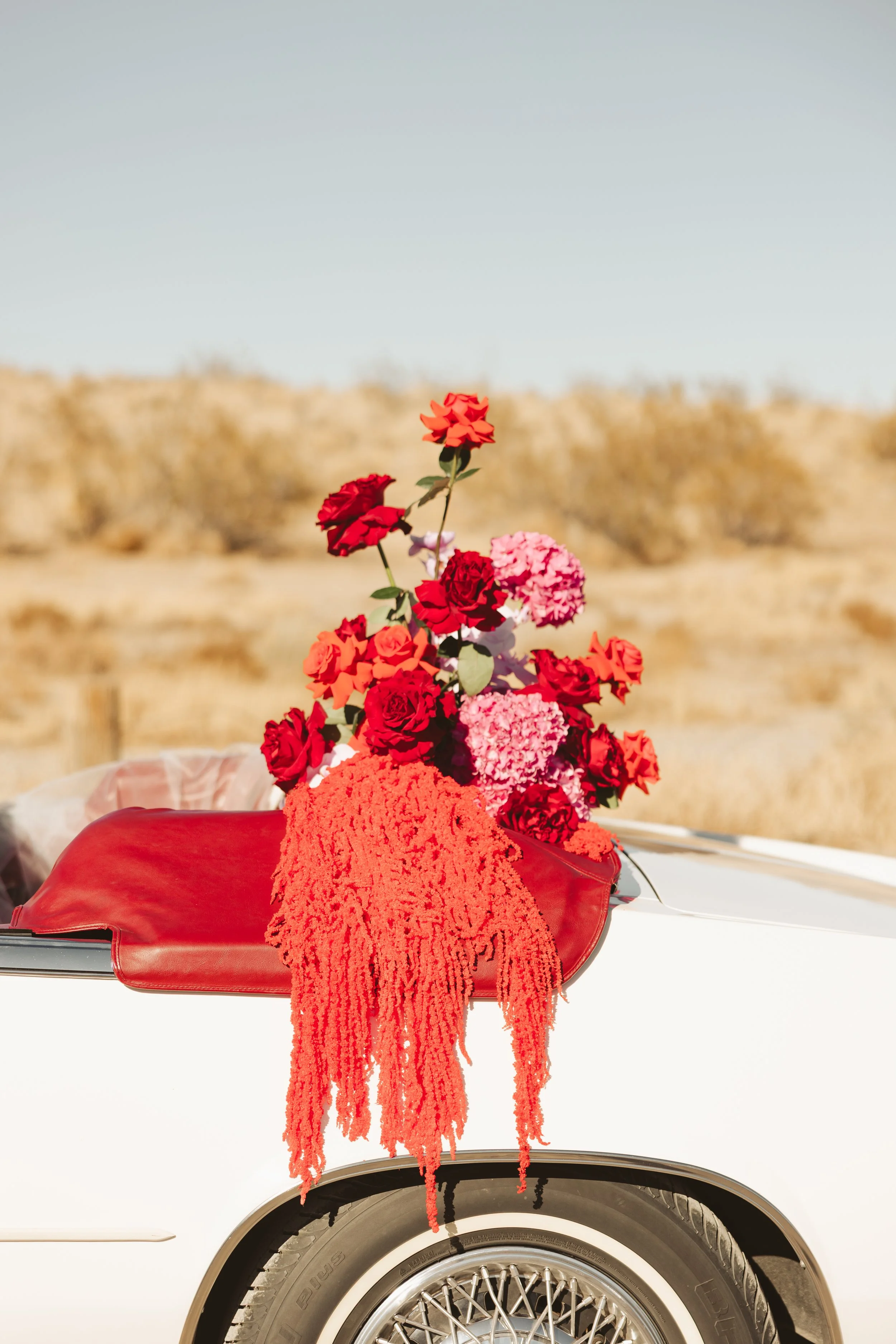 luxury car sweetheart table florals