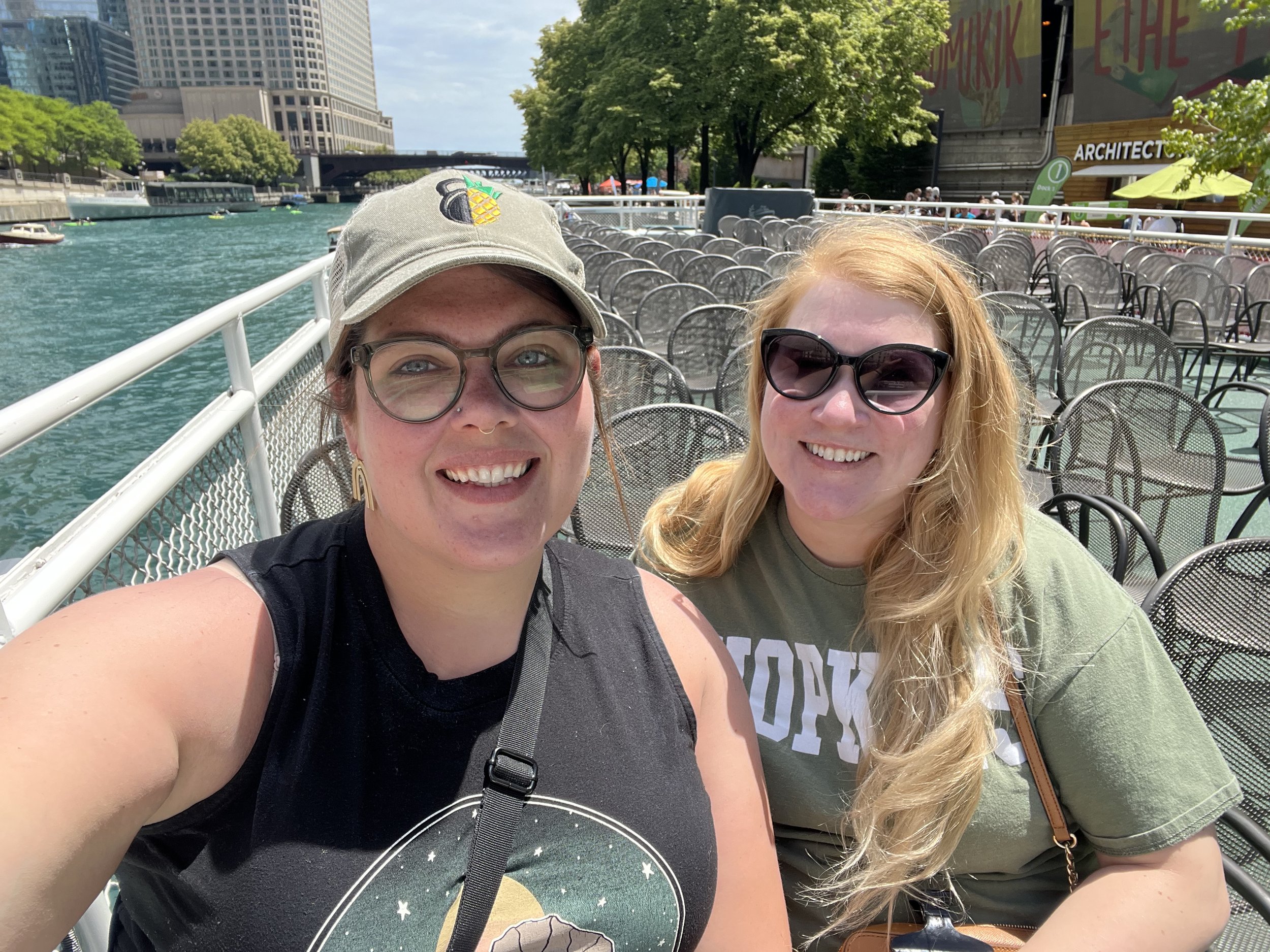 two travelers pose at a waterfront location in chicago, il