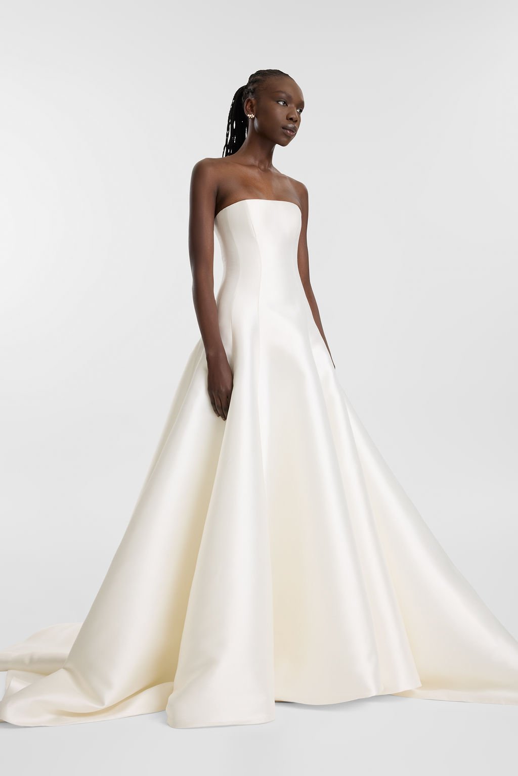 KYHA Adler wedding dress at The Aisle bridal boutique in Skipton, Yorkshire. Modern strapless Mikado wedding dress with structured corset bodice and fitted silhouette for fashion-forward brides.