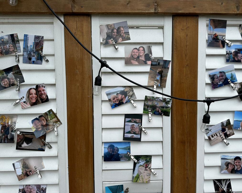 There are so many simple ways to make a wedding special! This photo wall brightened and captured this love story so beautifully.  Best of all, it cost nothing to do and was a conversation starter for many of the guests during formal photos and cockta