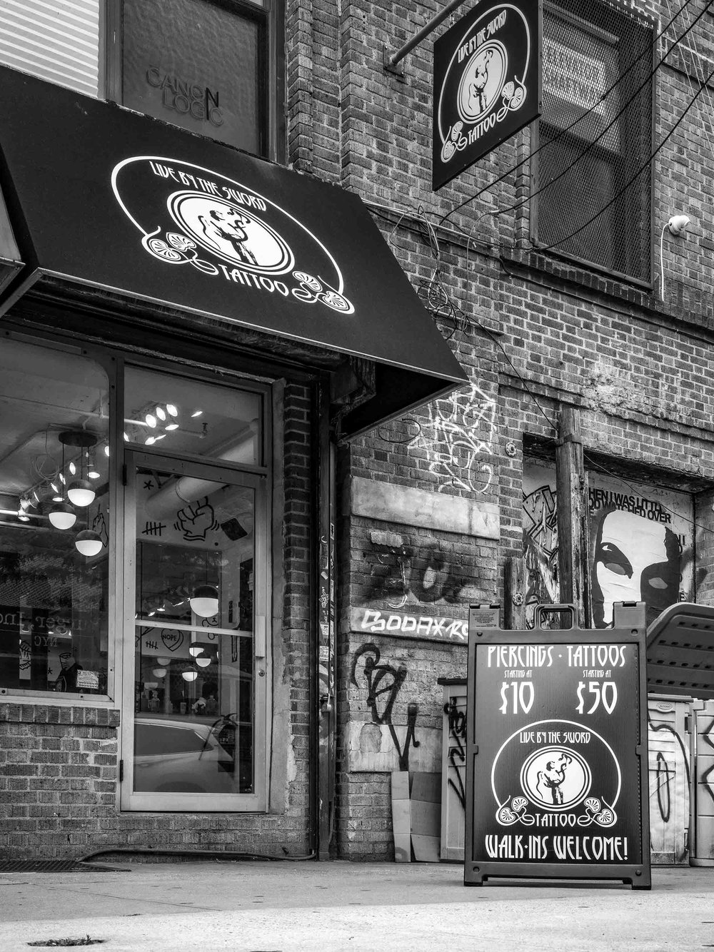 SOHO — LIVE BY THE SWORD TATTOO