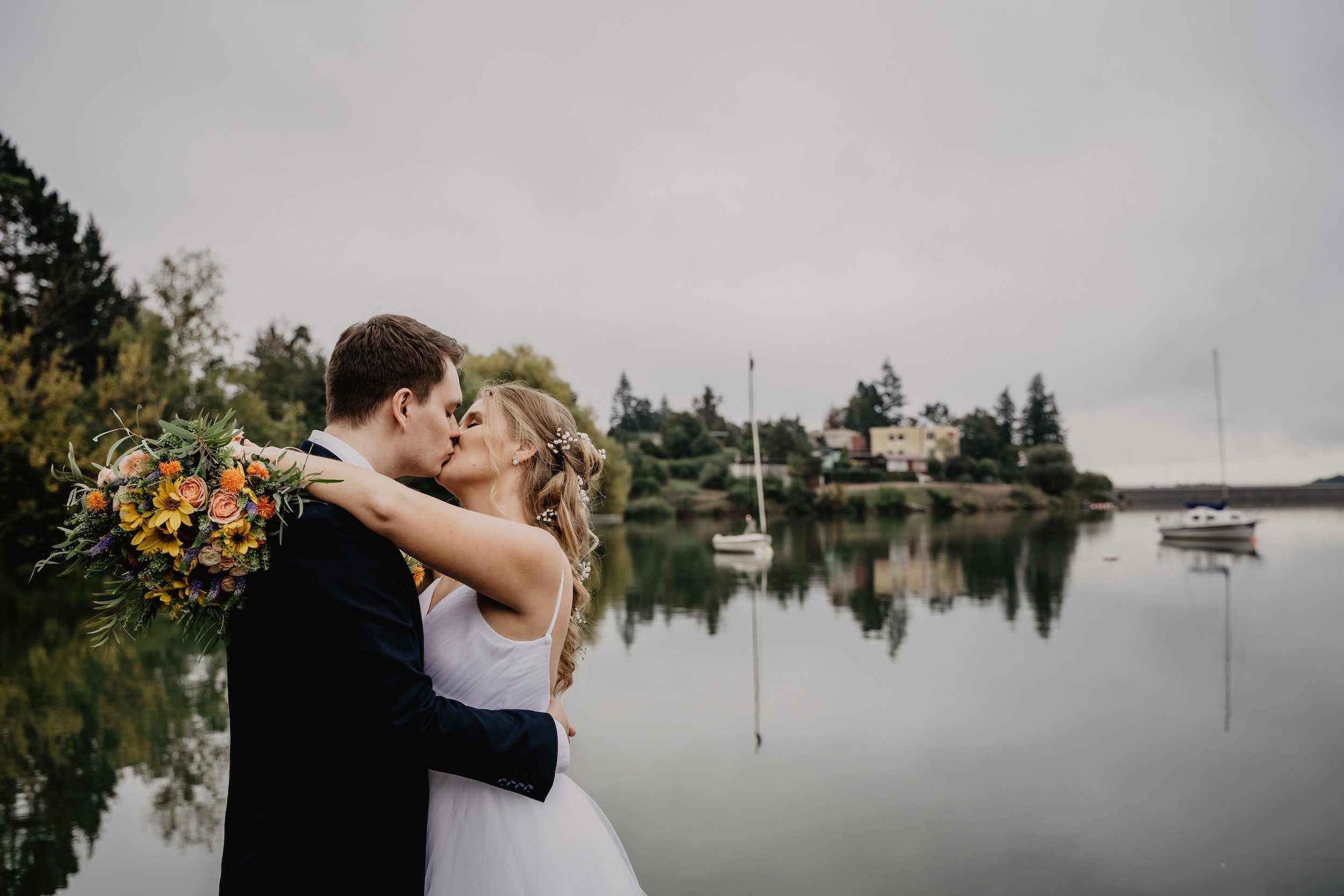 wedding ceremony and first kiss on a boat in Gloucester, MA