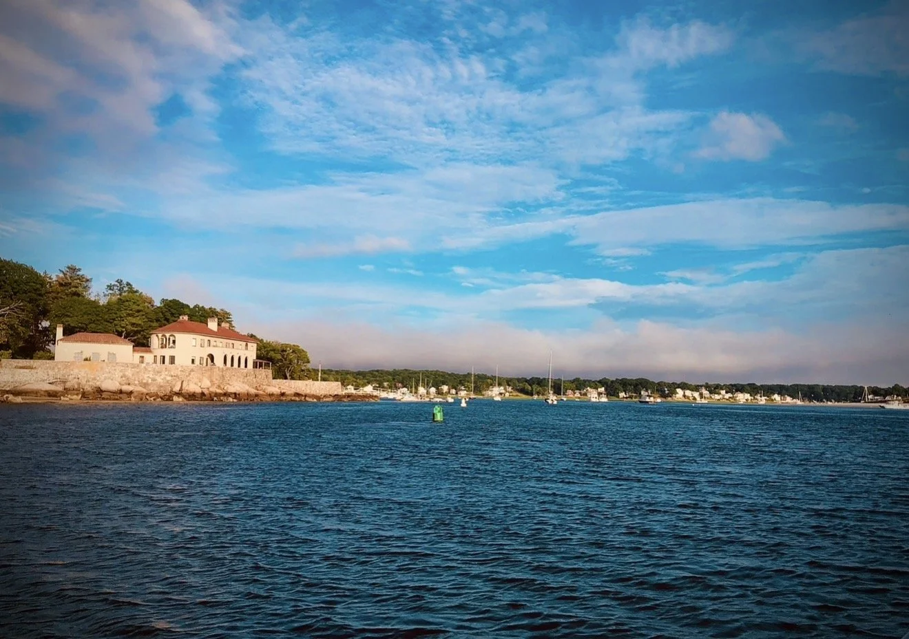 Salt marshes, coastal homes, and classic Cape Ann beauty from the water.