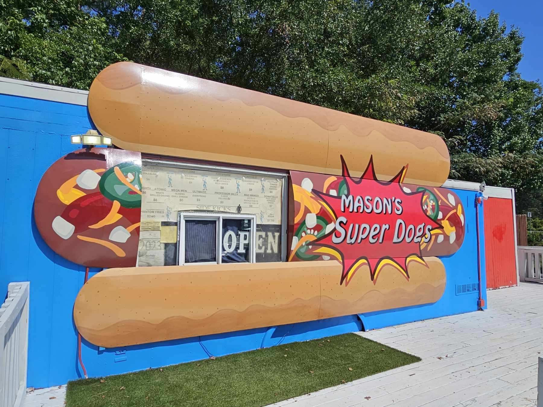 Mason's Super Dogs mural work and hand painted signage on metal