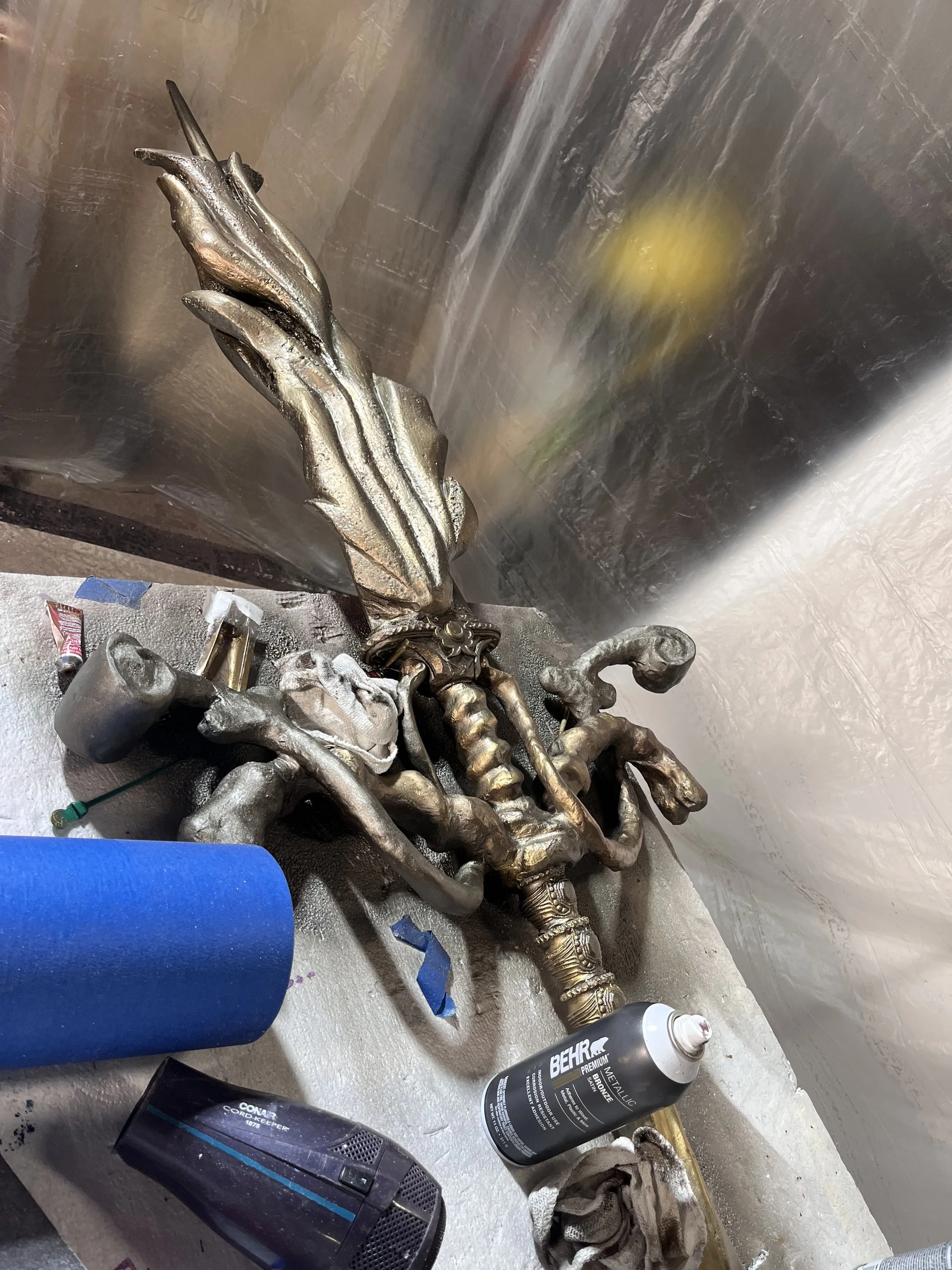 Detail shot of Elden Ring - Legend of Erdtree promo weapon prop (faux metal and age effects on metal, foam, epoxy clay, and 3D printed filament detail pieces)