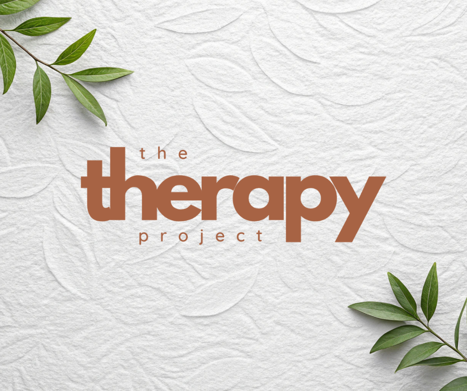 Text reads 'the therapy project' on a textured white background with green leaves in the corners.