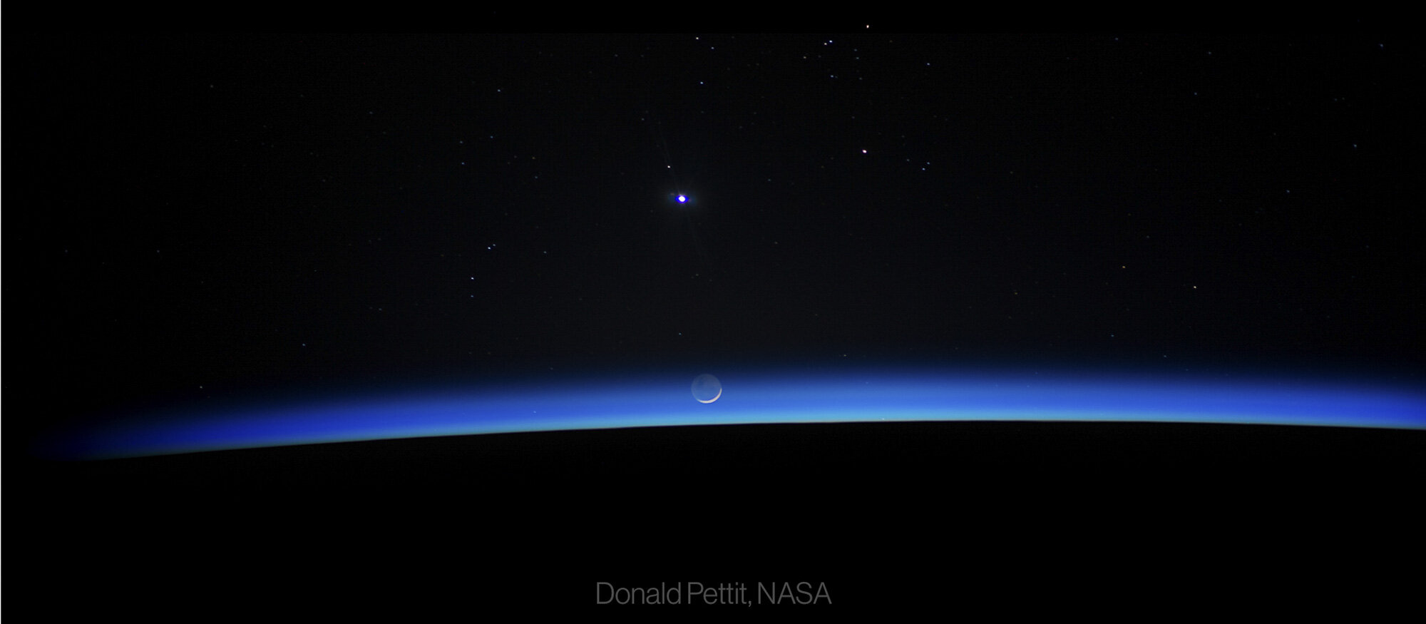  Earth horizon with waning crescent Moon, Jupiter, and Venus 