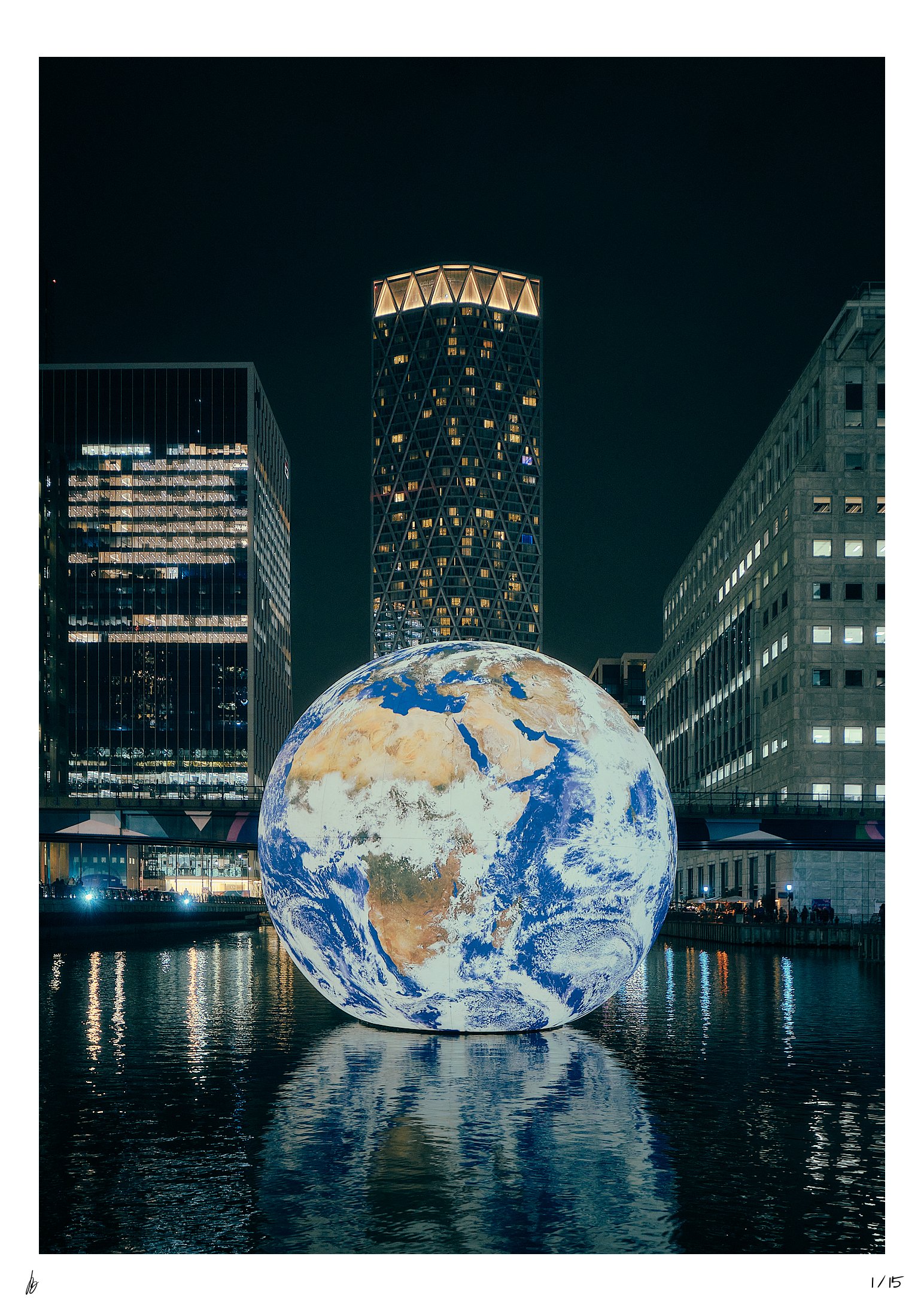 High-quality Photo Print of a glowing Planet Earth sculpture floating in a wharf in Canary Wharf, London