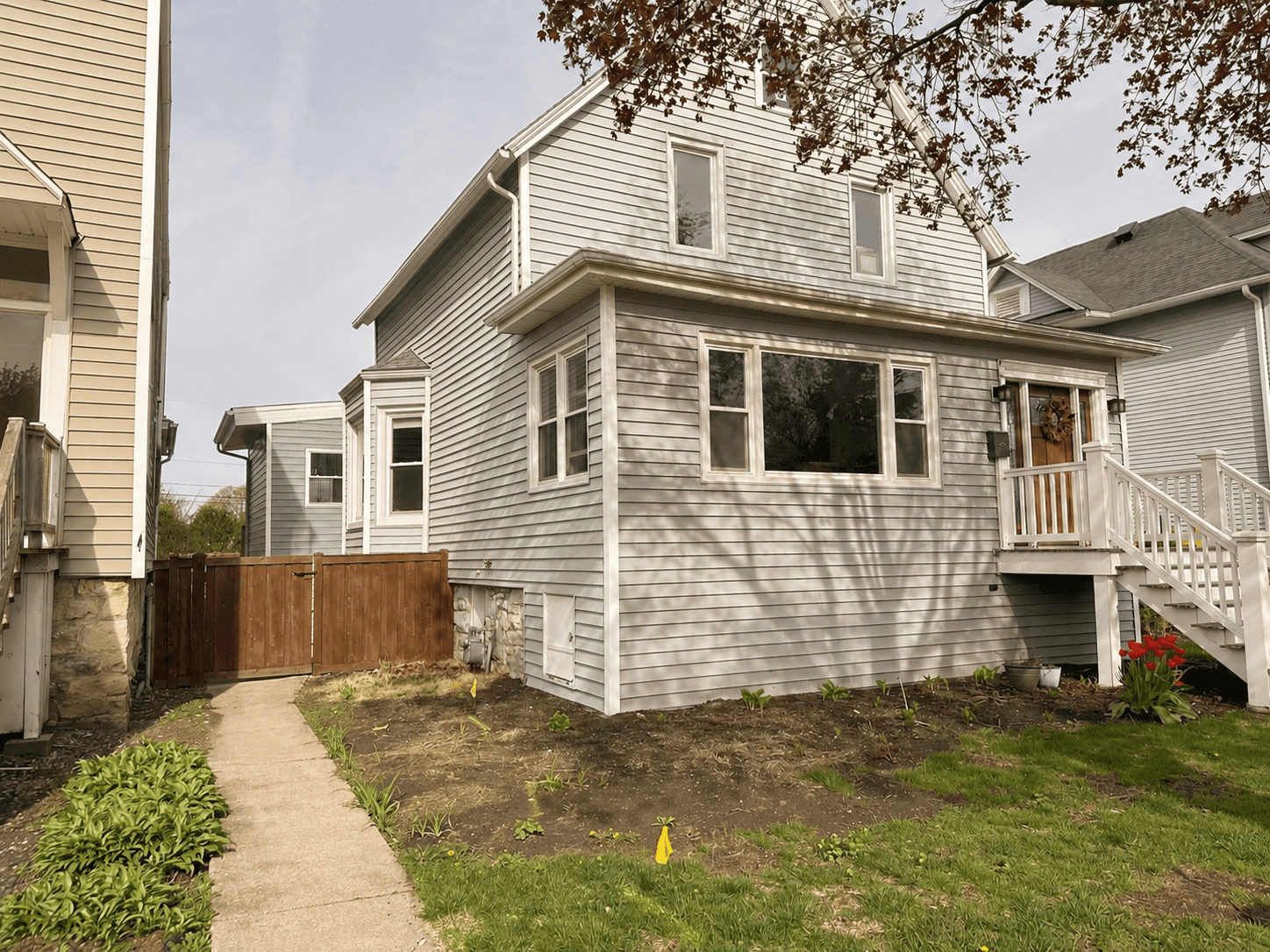 Before: a plain Berwyn front yard with good bones, but not much direction yet. The space was ready for softer edges, better flow, and a planting plan that felt more alive.