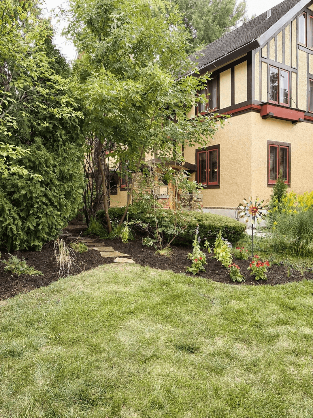 After: garden path view, a softer entry with shape, structure, and little moments of color unfolding through the front yard.