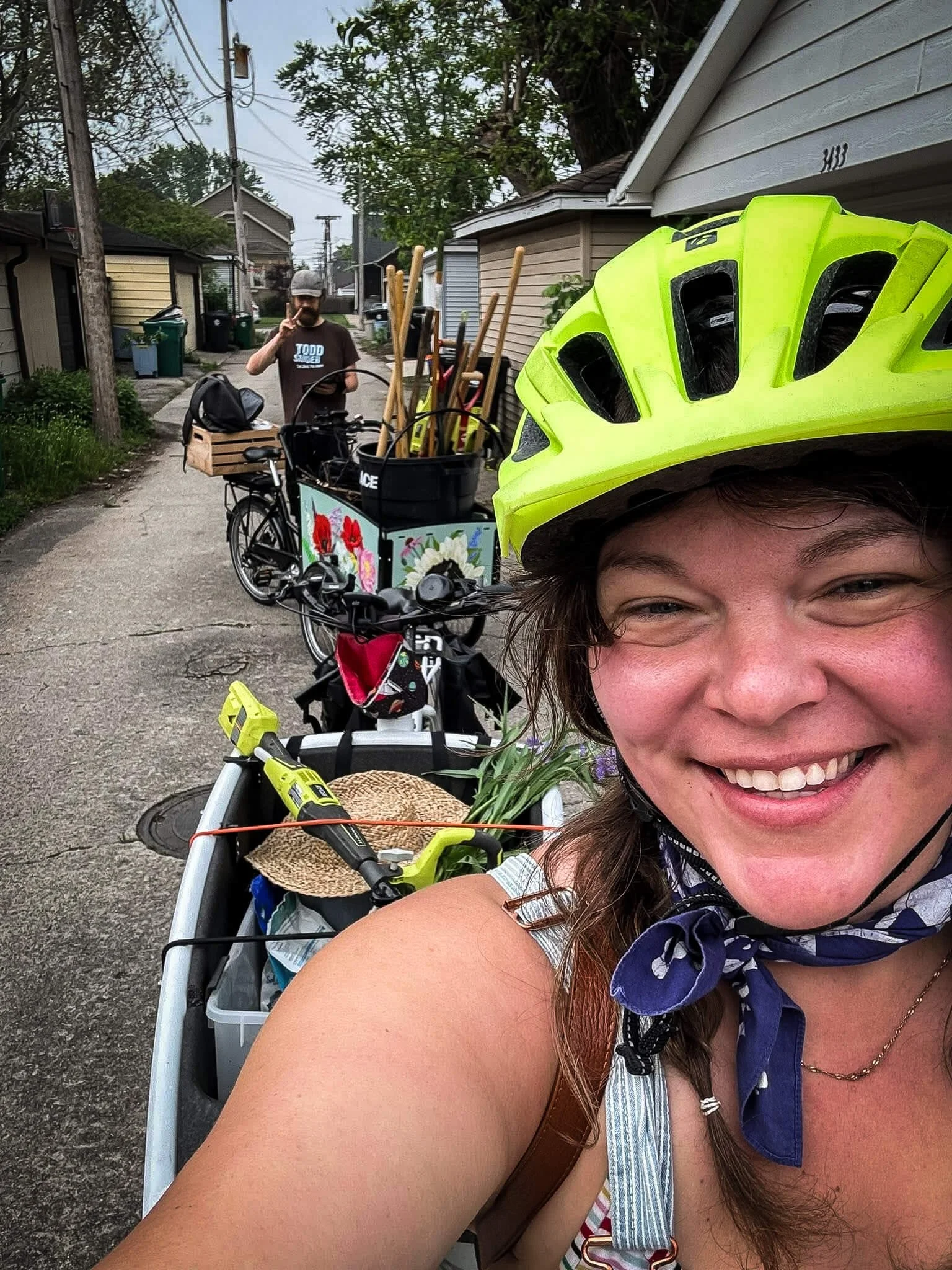 Julia biking to a neighborhood garden project with tools and plants. On brand!