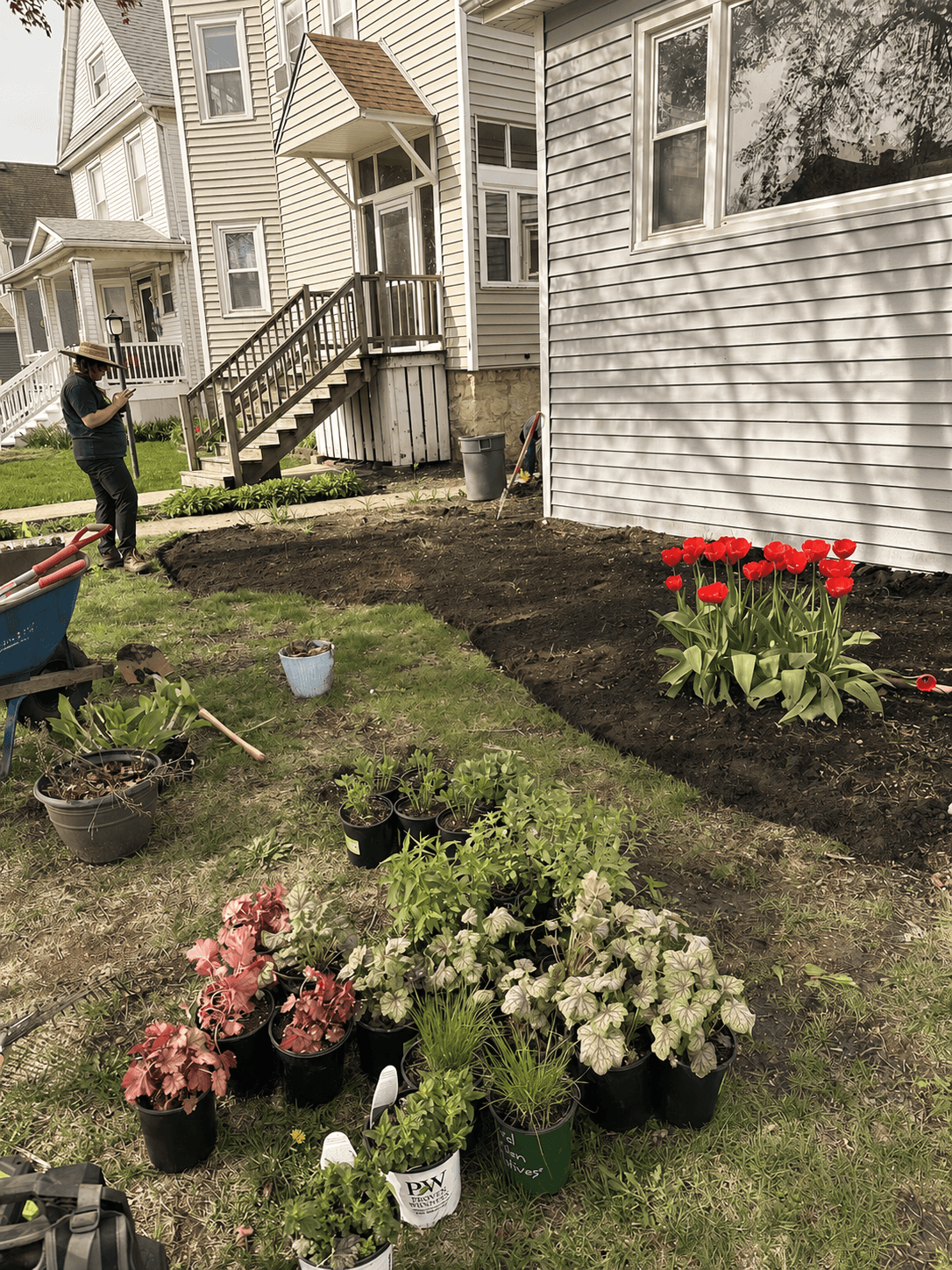 Before anything goes in the ground, Julia lays out the plants like a composition. Color, height, texture, and future growth all get considered before the first hole is dug.