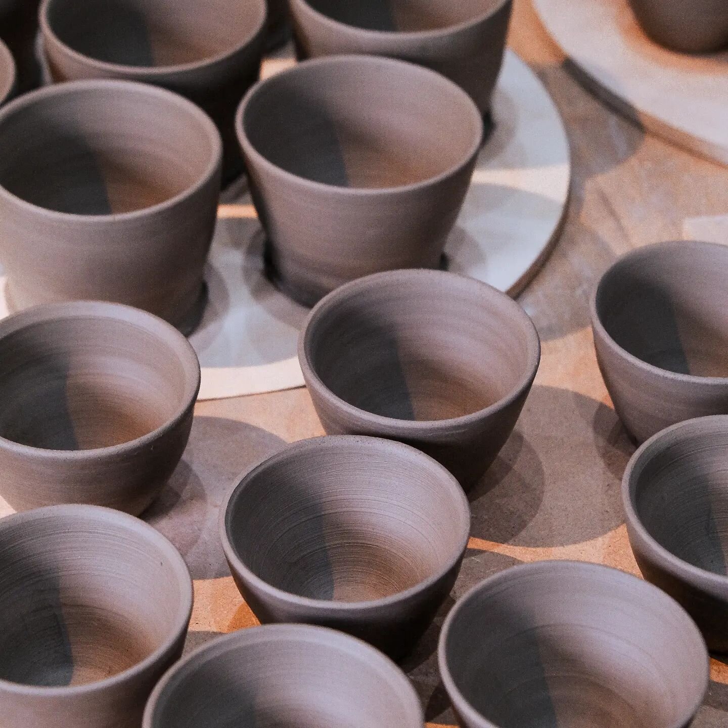 Little Coffee Cups for the lovely Cornershop. 

I throw a big batch of cups, all to the same diameter and curvature, then leave for 1 day until leather hard. Then trim back the excess and pray that they all dry nice and evenly. 

Restock coming soon,
