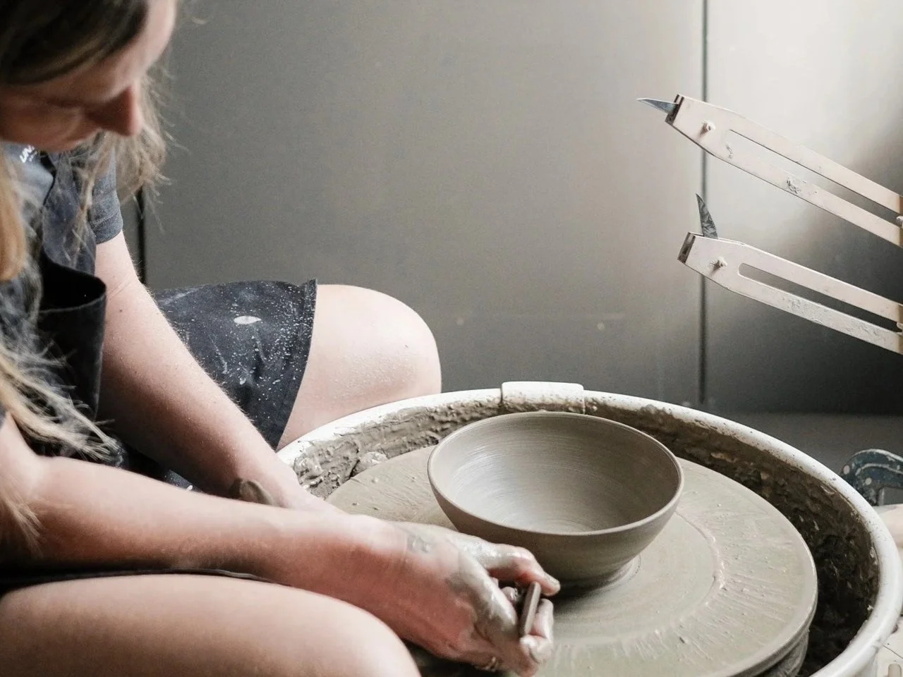 Emma, teaching a class on the pottery wheel in her studio in Macclesfield, Cheshire