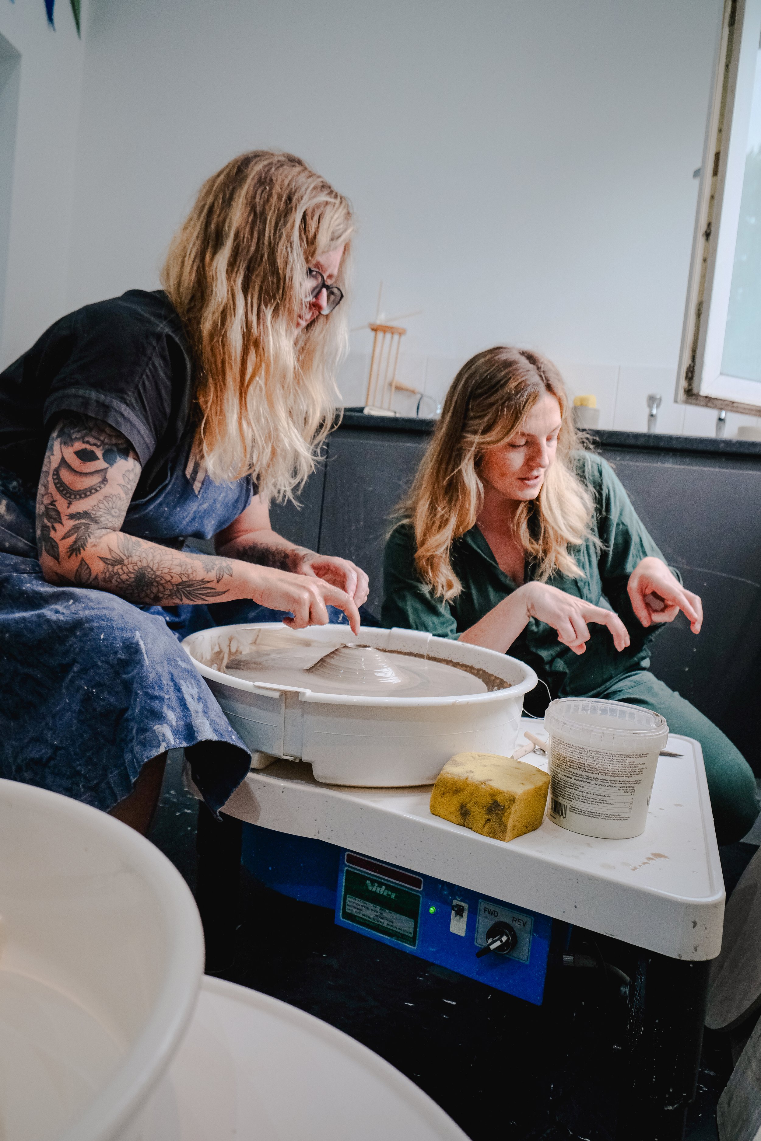 Emma teaching pottery moves in a pottery class in Macclesfield